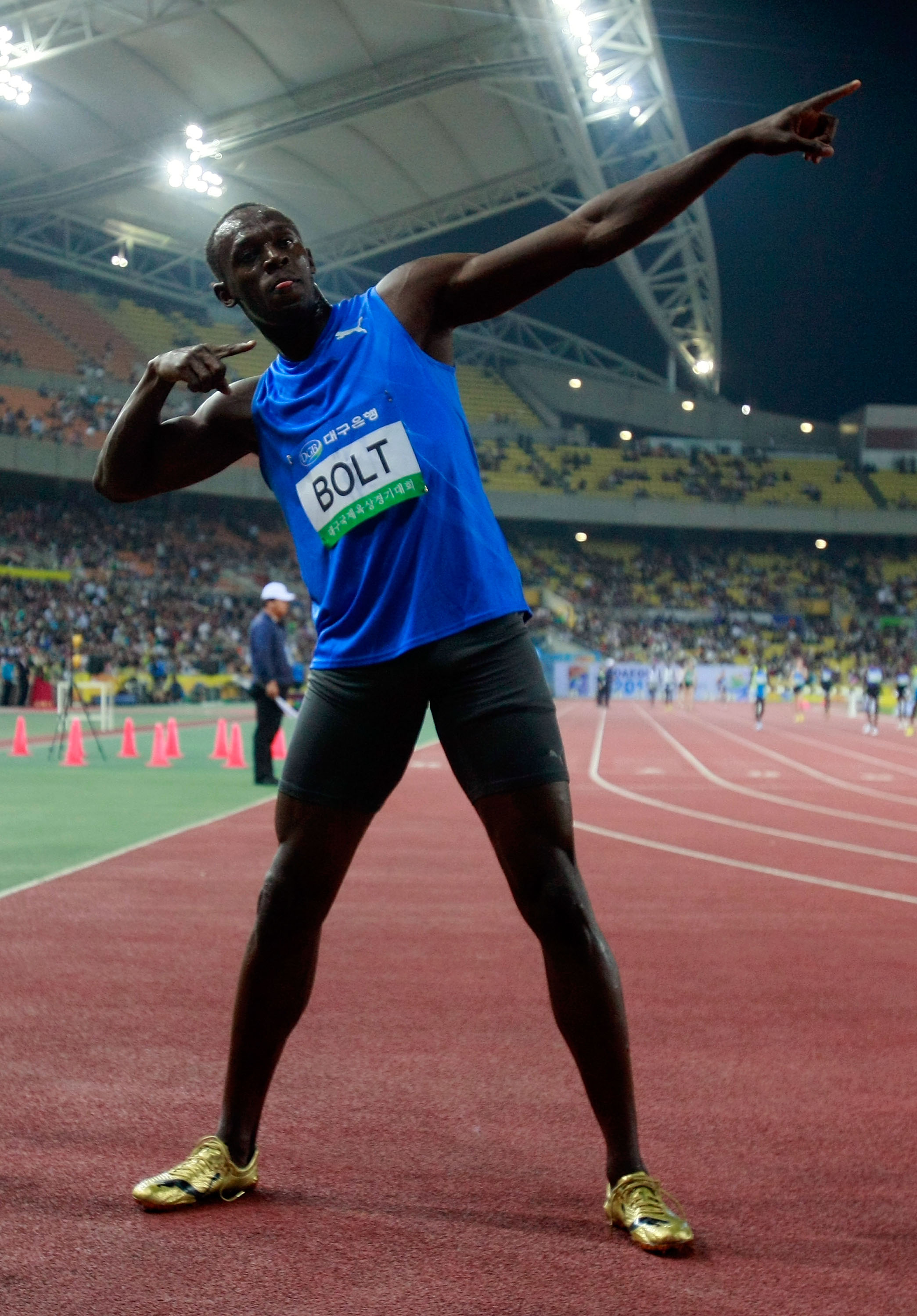 DAEGU, SOUTH KOREA - MAY 19:  Usain Bolt of Jamaica celebrates after winning the men's 100 metre race during the Colorful Daegu Pre-Championships Meeting 2010 at Daegu Stadium on May 19, 2010 in Daegu, South Korea. Bolt won the race at 9.86.  (Photo by Ch