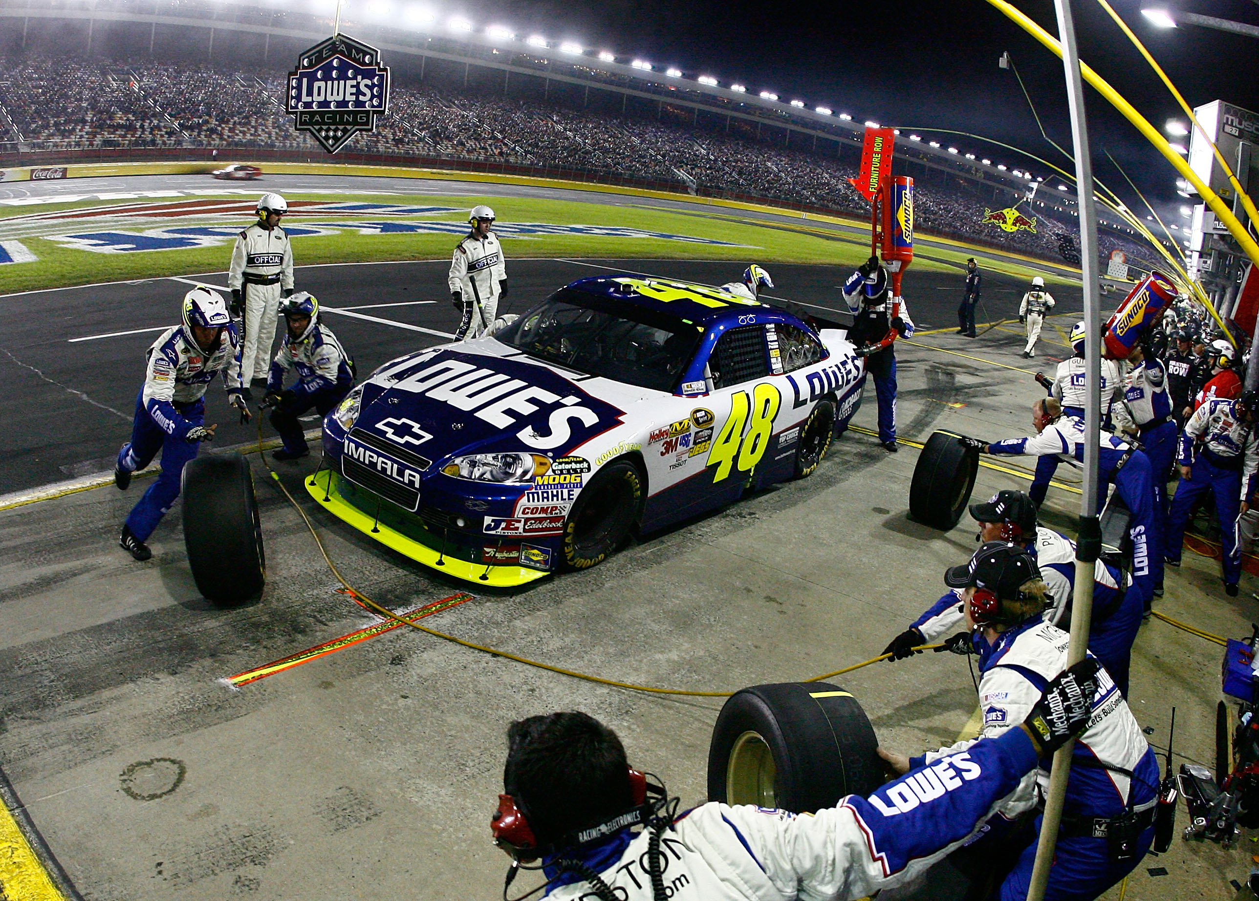 CONCORD, NC - OCTOBER 16:  Jimmie Johnson, driver of the #48 Lowe's Chevrolet, pits during the NASCAR Sprint Cup Series Bank of America 500 at Charlotte Motor Speedway on October 16, 2010 in Concord, North Carolina.  (Photo by Jason Smith/Getty Images for