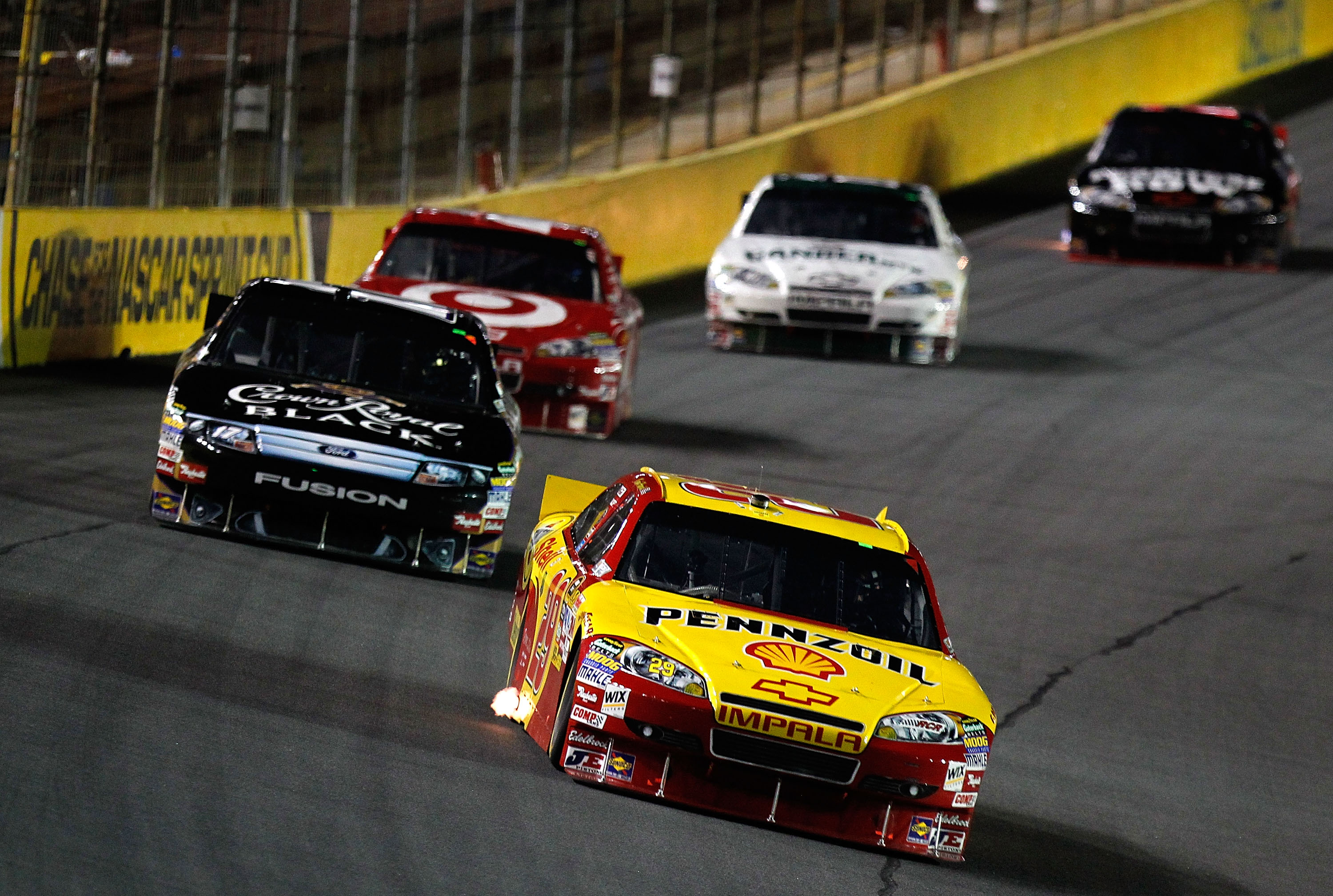 CONCORD, NC - OCTOBER 16:  Kevin Harvick, driver of the #29 Shell/Pennzoil Chevrolet, leads a group of cars during the NASCAR Sprint Cup Series Bank of America 500 at Charlotte Motor Speedway on October 16, 2010 in Concord, North Carolina.  (Photo by Geof