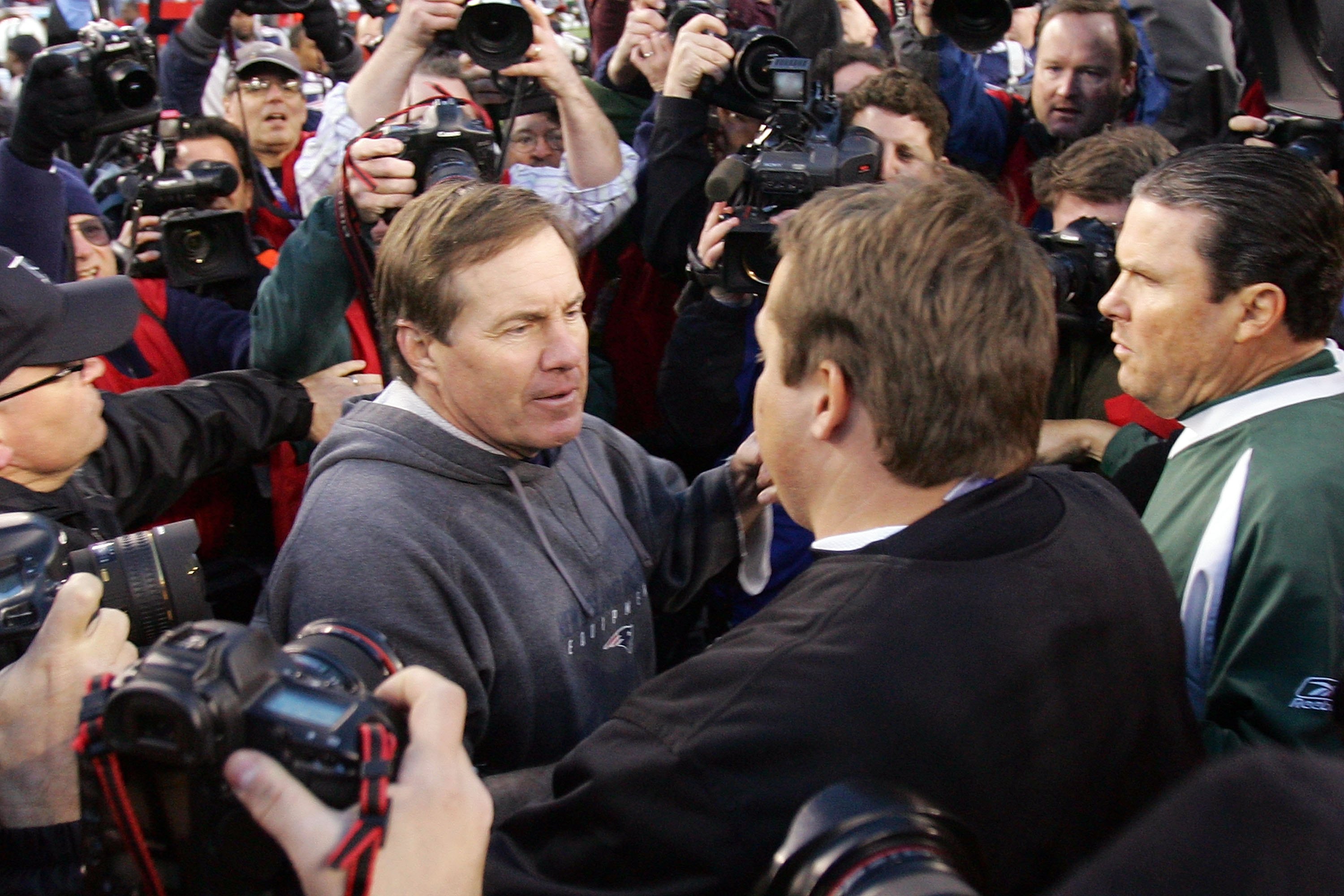 FOXBORO, MA - JANUARY 07:  Head coach Eric Mangini of the New York Jets shakes hand with head coach Bill Belichick of  the New England Patriots after their AFC Wild Card Playoff Game at Gillette Stadium on January 7, 2007 in Foxboro, Massachusetts. The Pa