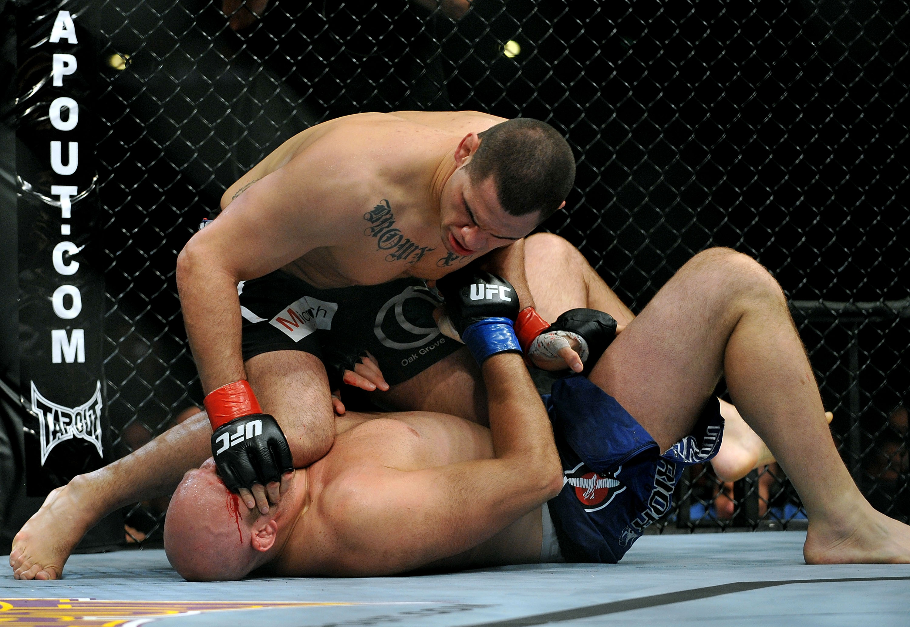 LOS ANGELES, CA - OCTOBER 24:  UFC fighter Cain Velasquez (top) battles with UFC fighter Ben Rothwell (bottom) during their Heavyweight bout at UFC 104: Machida vs. Shogun at Staples Center on October 24, 2009 in Los Angeles, California.  (Photo by Jon Ko