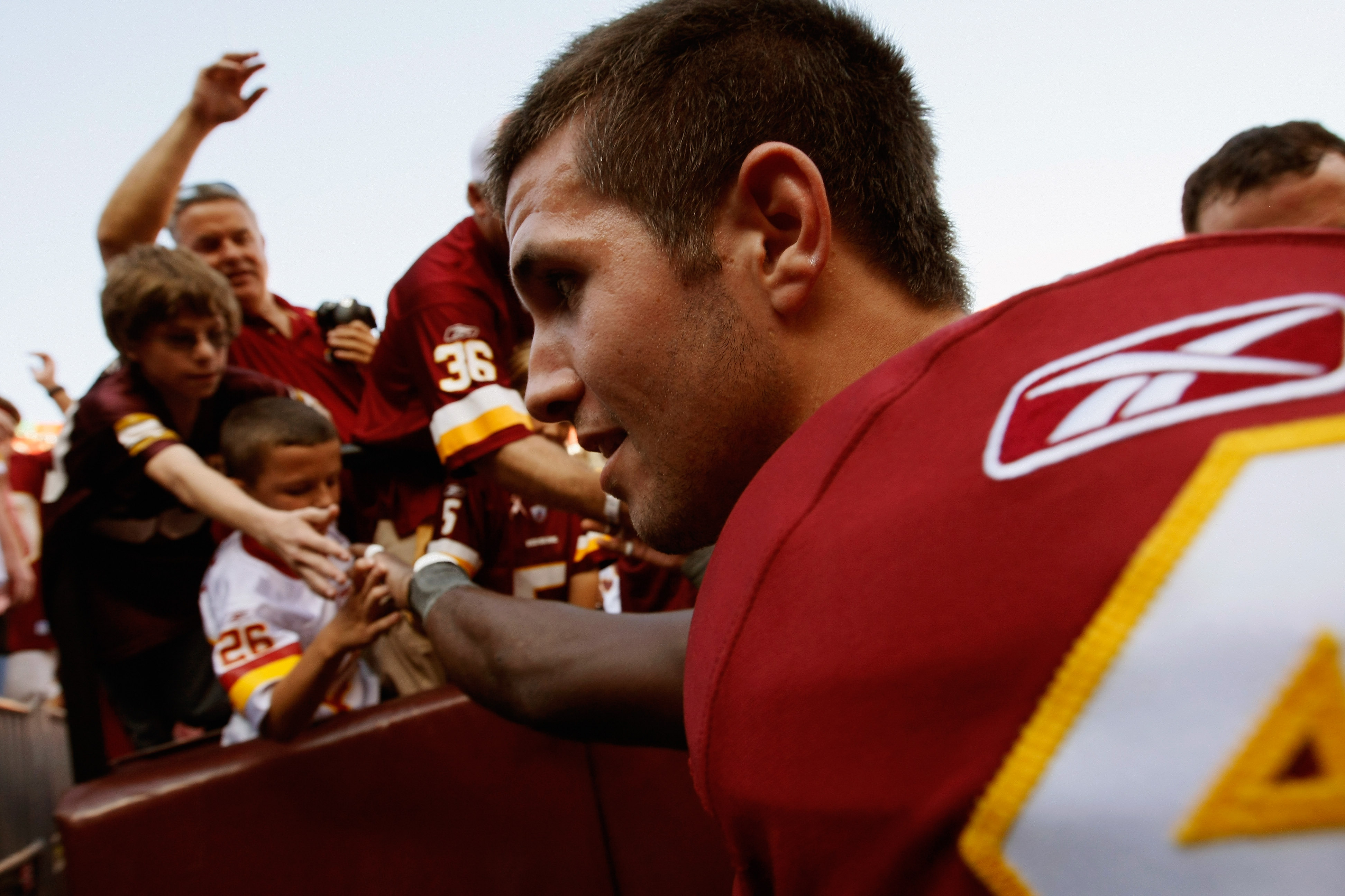 LANDOVER, MD - OCTOBER 10:  Kicker Graham Gano #4 of the Washington Redskins is greeted by fans after kicking the game winning field goal in overtime against the Green Bay Packers at FedExField on October 10, 2010 in Landover, Maryland. The Redskins won t