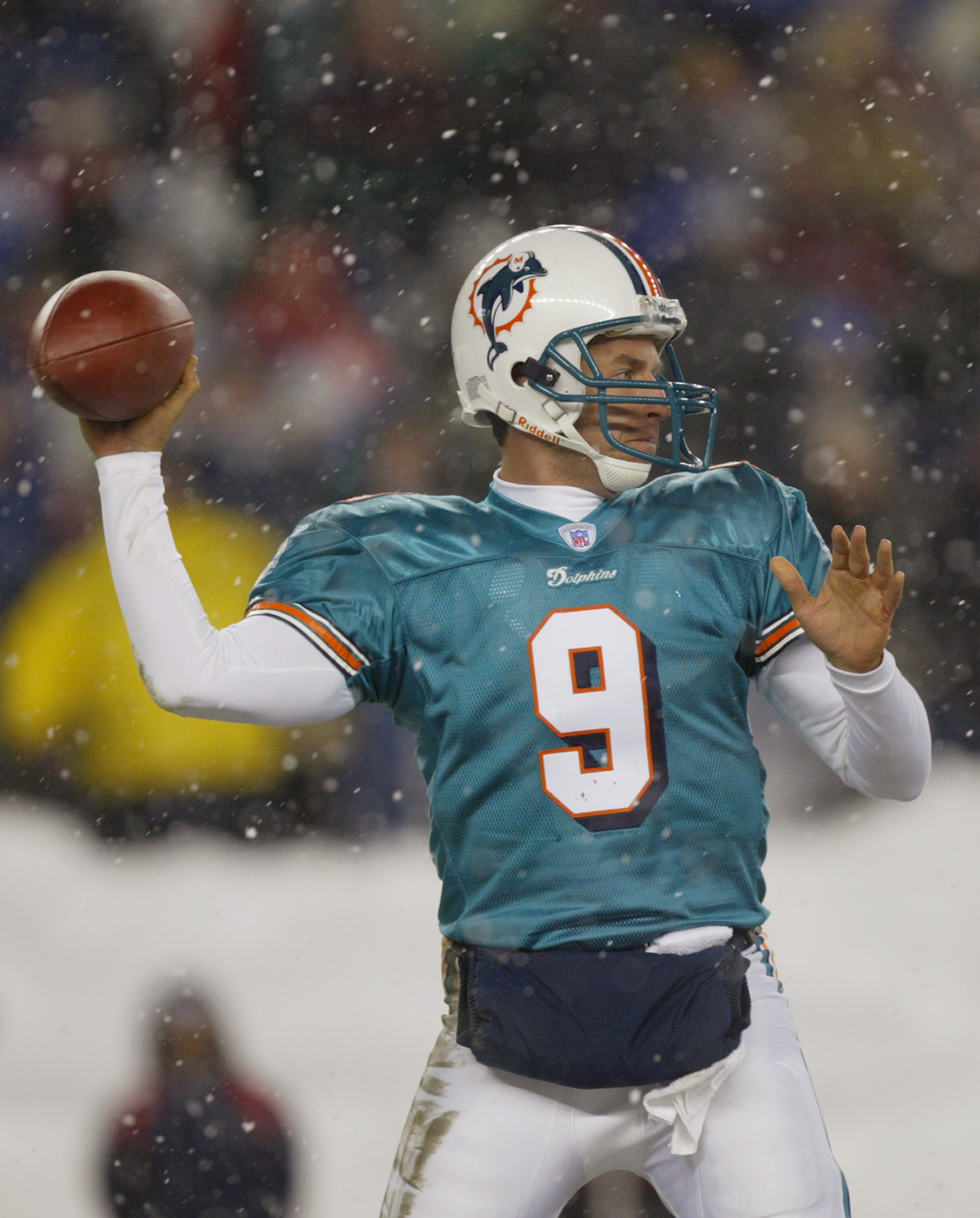 FOXBORO, MA - DECEMBER 7:  Quarterback Jay Fiedler #9 of the Miami Dolphins passses the ball against the New England Patriots during the game at Gillette Stadium on December 7, 2003 in Foxboro, Massachusetts. The Patriots defeated the Dolphins 16-0.  (Pho