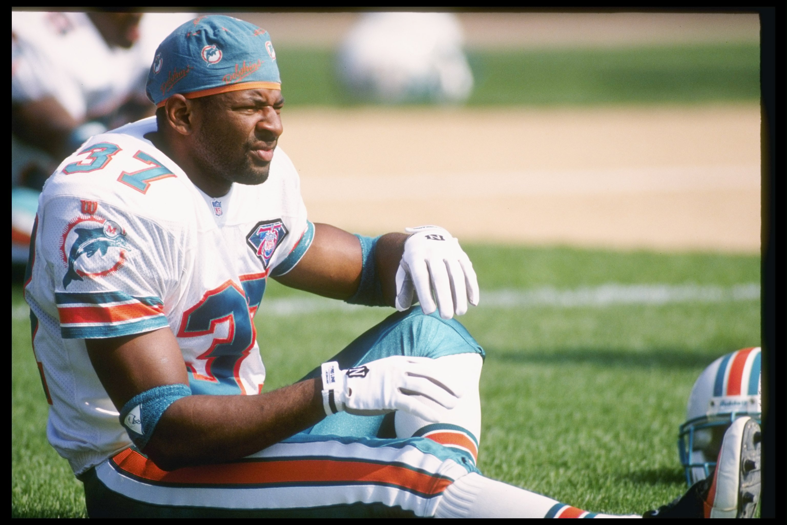 11 Sep 1994:  Cornerback J.B. Brown of the Miami Dolphins stretches out before a game against the Green Bay Packers at Milwaukee County Stadium in Milwaukee, Wisconsin.  The Dolphins won the game 24-14. Mandatory Credit: Jonathan Daniel  /Allsport
