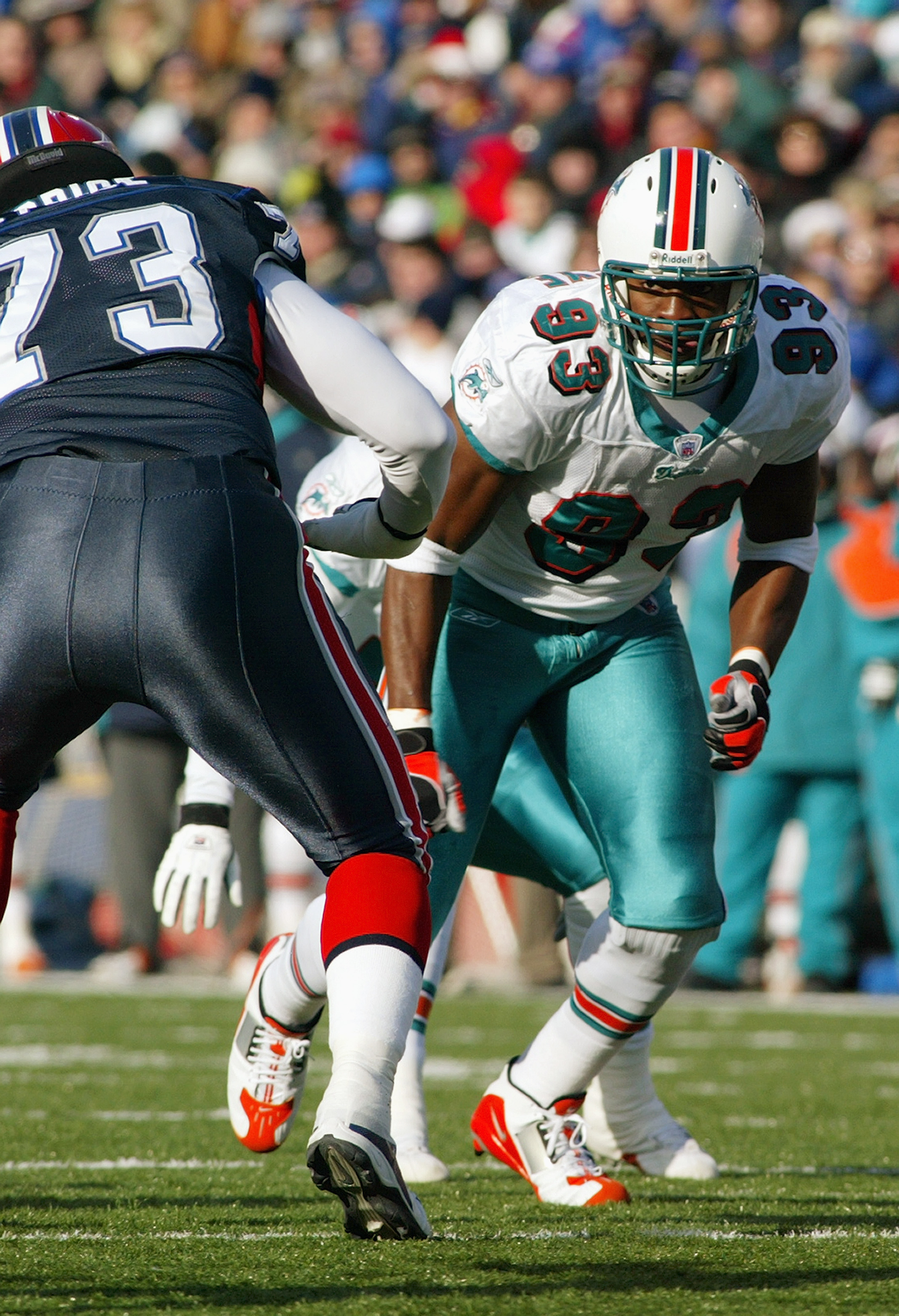 ORCHARD PARK, NY - DECEMBER 21:  Defensive end Adewale Ogunleye #93 of the Miami Dolphins looks to avoid getting blocked by offensive tackle Marcus Price #73 of the Buffalo Bills during the game on December 21, 2003 at Ralph Wilson Stadium in Orchard Park