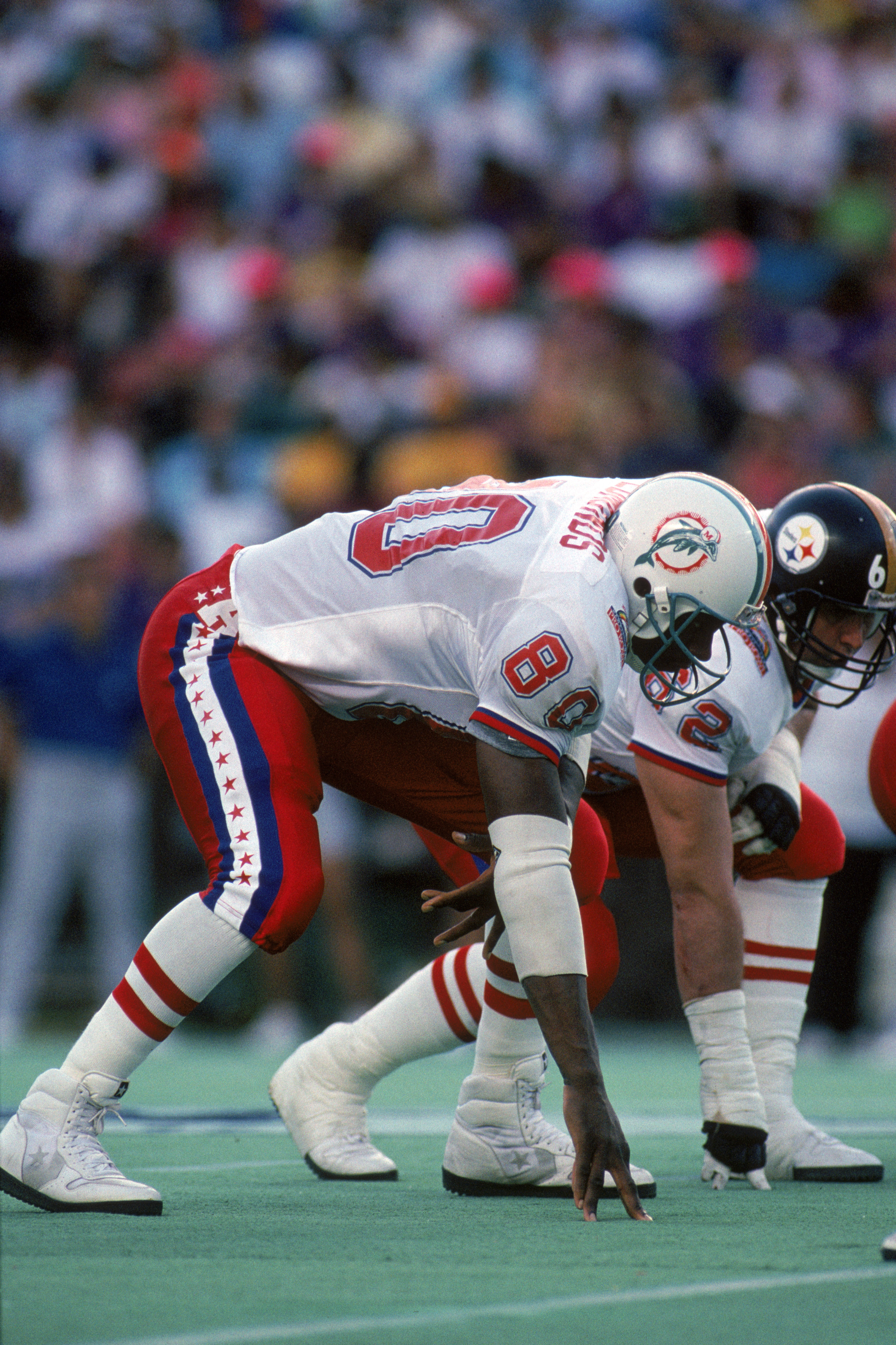 HONOLULU, HI - FEBRUARY 4:  Miami Dolphins tight end Ferrell Edmunds #80 of the AFC squad lines up at the line of scrimmage during the 1990 NFL Pro Bowl at Aloha Stadium on February 4, 1990 in Honolulu, Hawaii.  The NFC won 27-21.  (Photo by George Rose/G