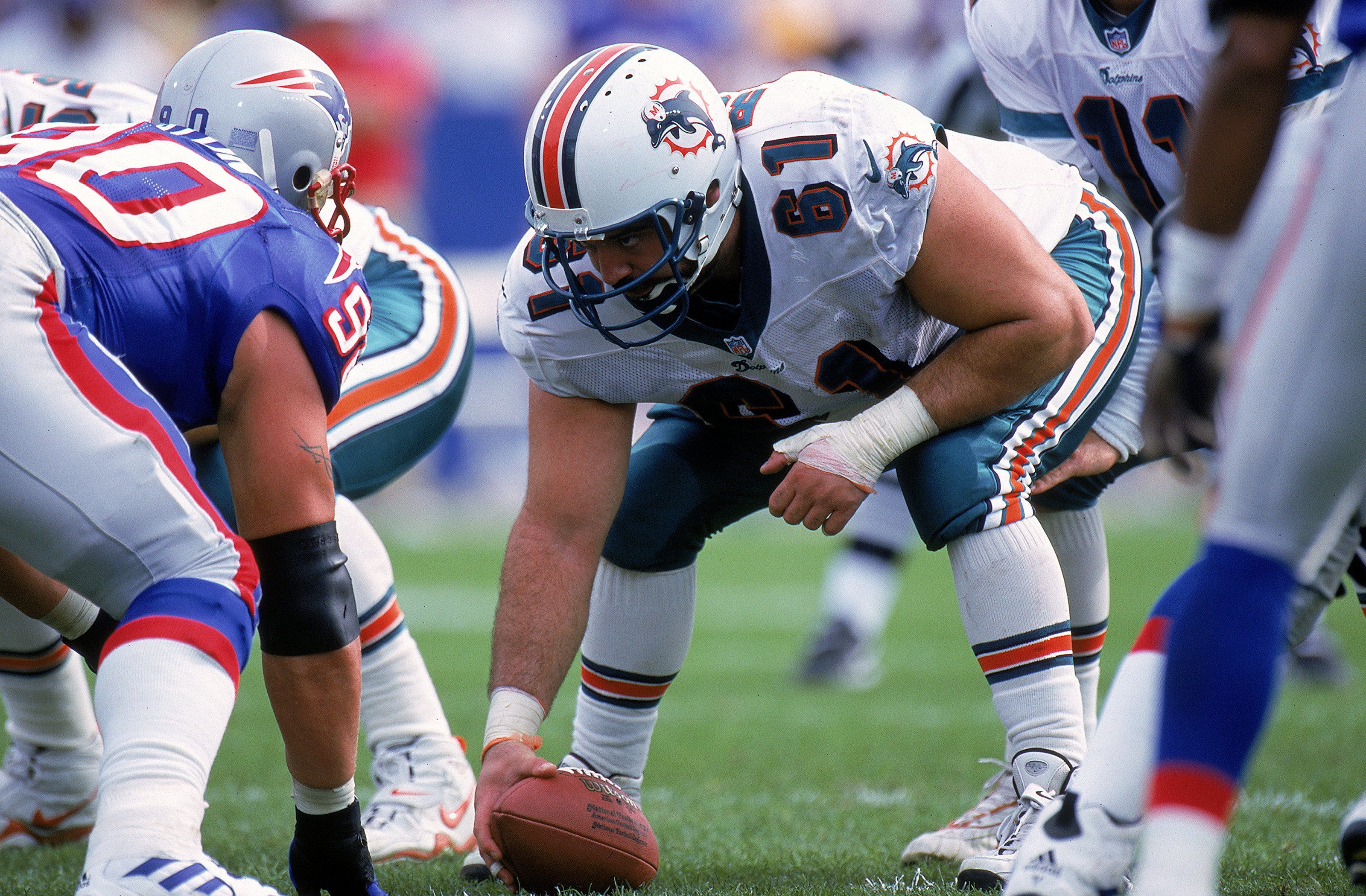 17 Oct 1999: Tim Ruddy #61 of the Miami Dolphins gets ready to hike the ball during the game against the New England Patriots at the Foxboro Stadium in Foxboro, Massachusetts. The Dolphins defeated the Patriots 31-30.