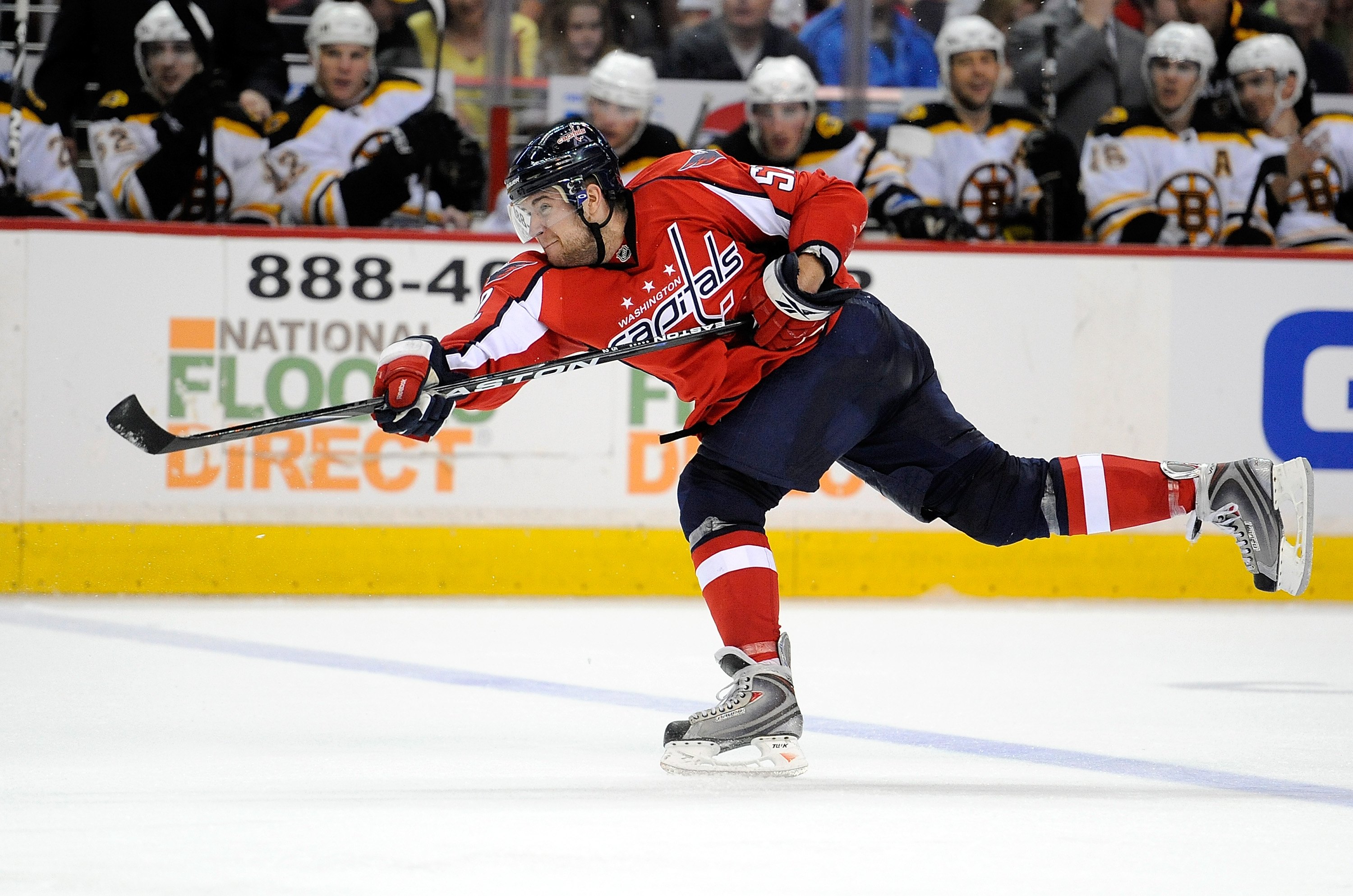 WASHINGTON - APRIL 11:  Mike Green #52 of the Washington Capitals shoots the puck against the Boston Bruins at the Verizon Center on April 11, 2010 in Washington, DC.  (Photo by Greg Fiume/Getty Images)