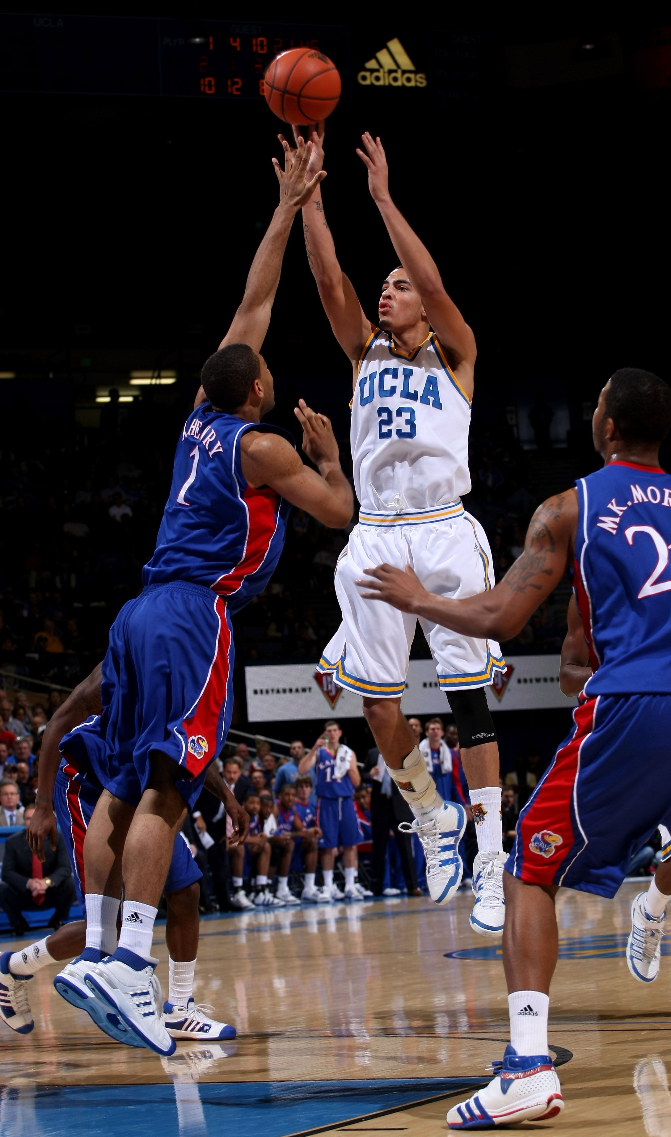 WESTWOOD, CA - DECEMBER 06: Tyler Honeycutt #23 of the UCLA Bruins shoots over Xavier Henry #1 of the Kansas Jayhawks on December 6, 2009 at Pauley Pavillion in Westwood, California. Kansas won 73-61. (Photo by Stephen Dunn/Getty Images)