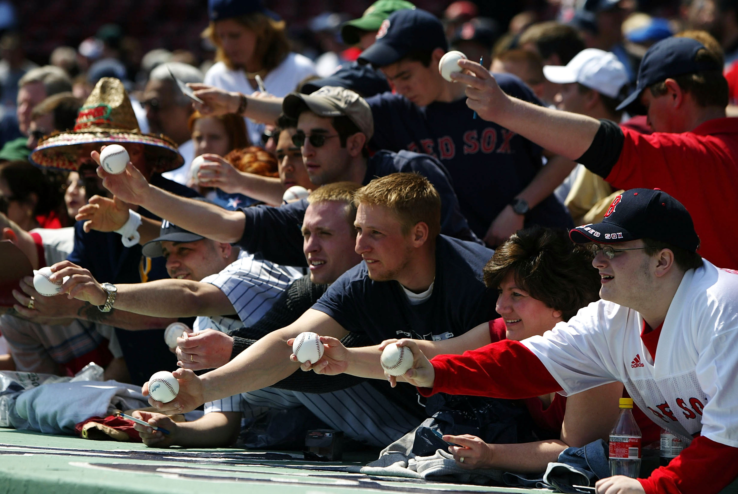 BOSTON - APRIL 17:  Fans hope for autographs before the game between the Boston Red Sox and the New York Yankees on April 17, 2004 at Fenway Park in Boston, Massachusetts. The Red Sox won 5-2.  (Photo by Ezra Shaw/Getty Images)