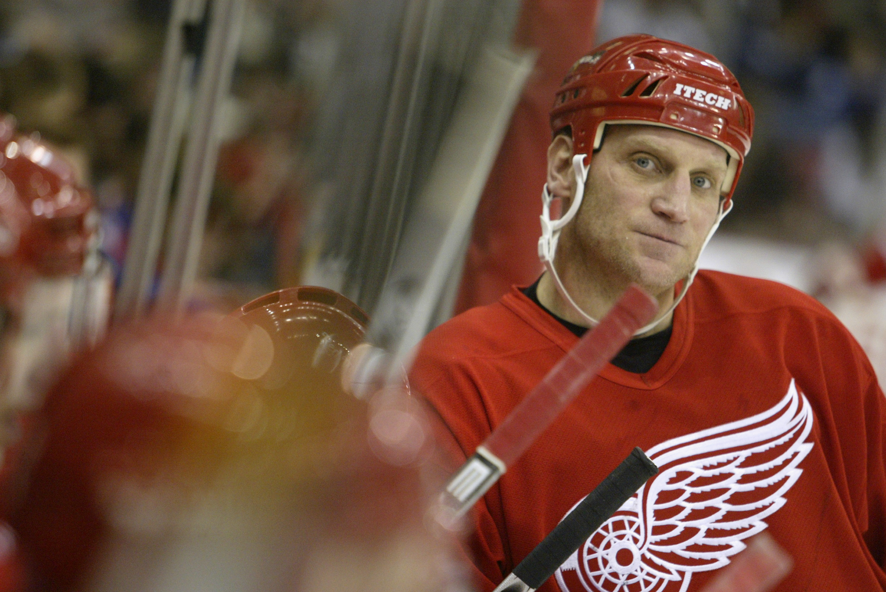 DETROIT - DECEMBER 19:  Brett Hull #17 of the Detroit Red Wings looks on from the bench area during a break in game action against the Chicago Blackhawks on December 19, 2003 at Joe Louis Arena in Detroit, Michigan. The Red Wings defeated the Blackhawks 3