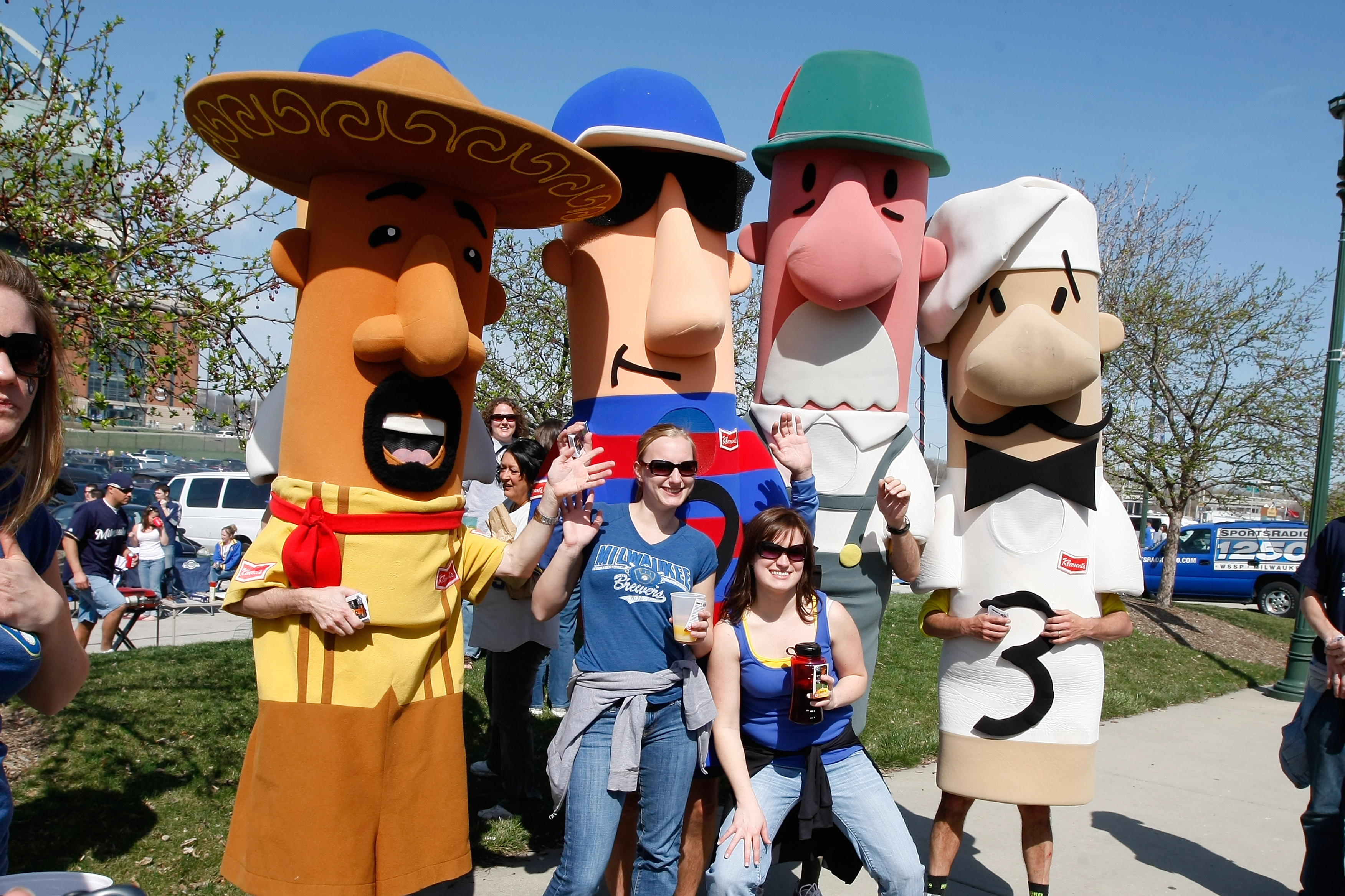 MILWAUKEE, WI - APRIL 05: Brewers fans pose with the racing sausages in the parking lots outside of Miller Park prior to the game between the Colorado Rockies and the Milwaukee Brewers at Miller Park on April 5, 2010 in Milwaukee, Wisconsin. (Photo by Sco