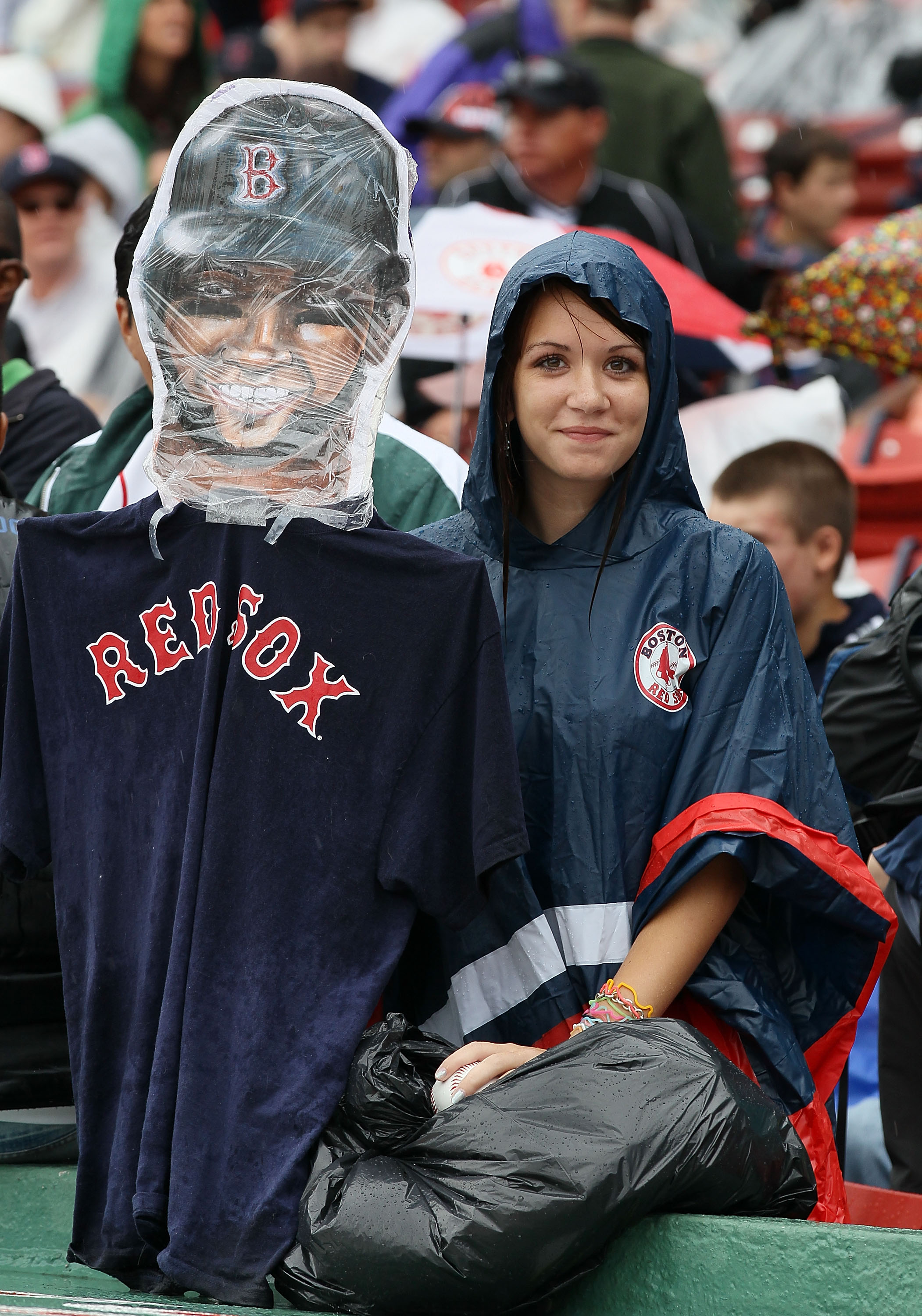 BOSTON - AUGUST 22:  Fans wait out the rain delay for the Toronto Blue Jays versus the Boston Red Sox game on August 22, 2010 at Fenway Park in Boston, Massachusetts.  (Photo by Elsa/Getty Images)
