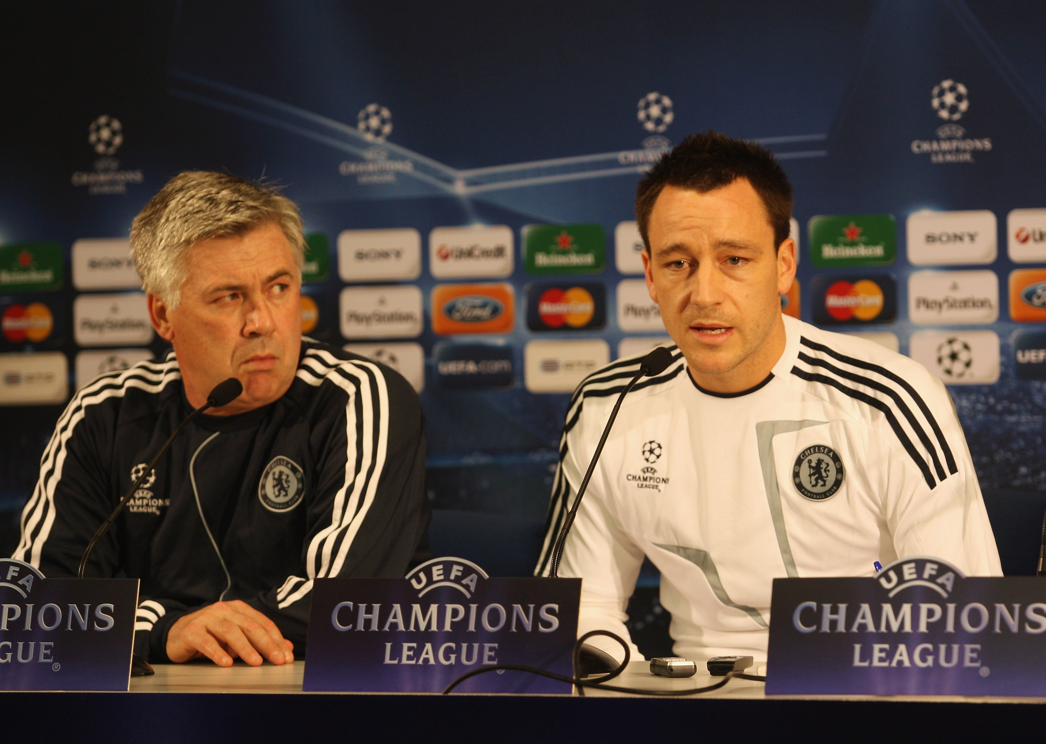 PORTO, PORTUGAL - NOVEMBER 24:  Captain John Terry speaks as manager Carlo Ancelotti looks on during the Chelsea press conference, prior to UEFA Champions League Group D match against FC Porto, at the Estadio Dragao on November 24, 2009 in Porto, Portugal
