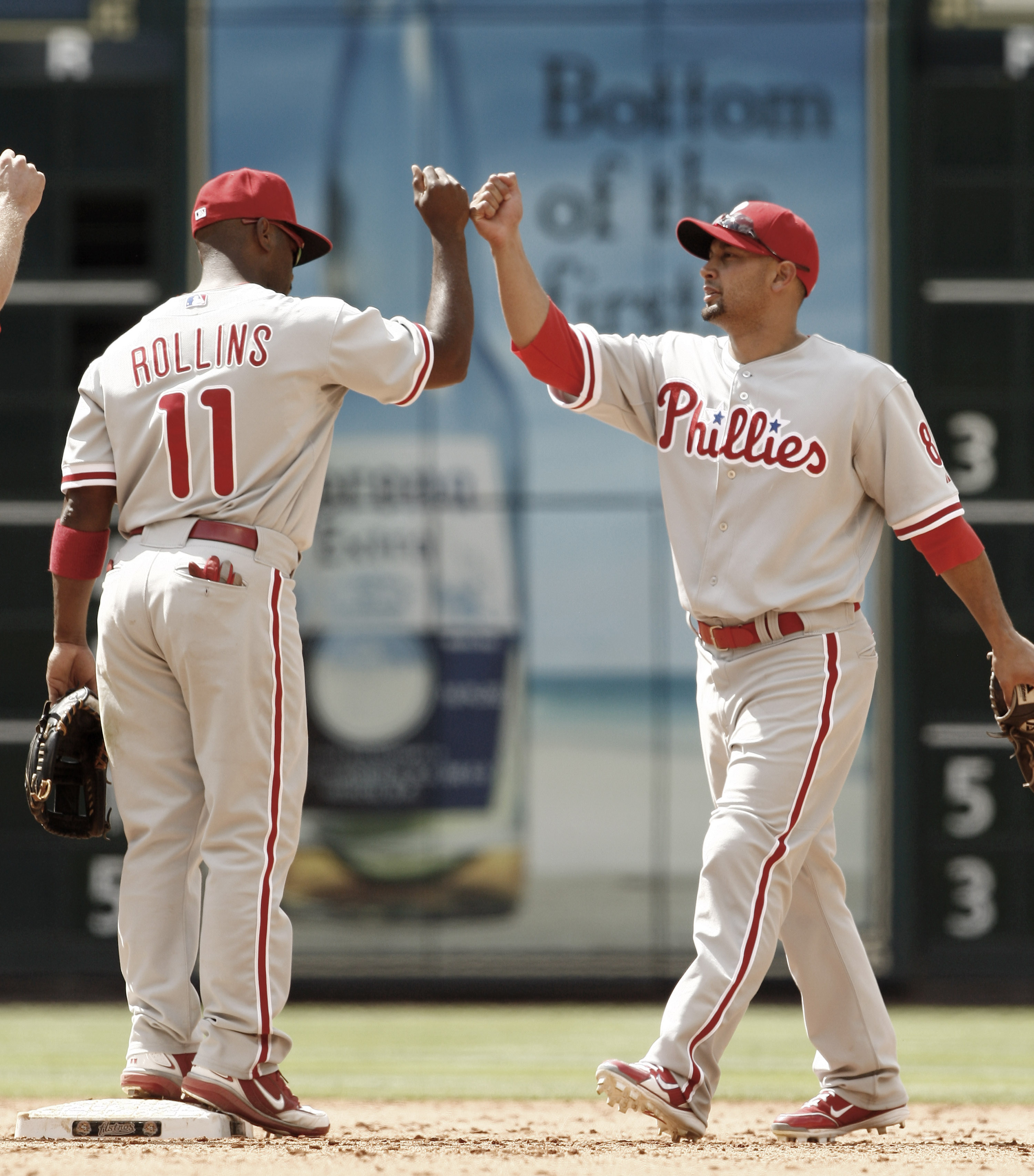 HOUSTON - APRIL 11:  Shane Victorino #8 of the Philadelphia Phillies high fives Jimmy Rollins #11 after defeating the Houston Astros 2-1 at Minute Maid Park on April 11, 2010 in Houston, Texas.  (Photo by Bob Levey/Getty Images)