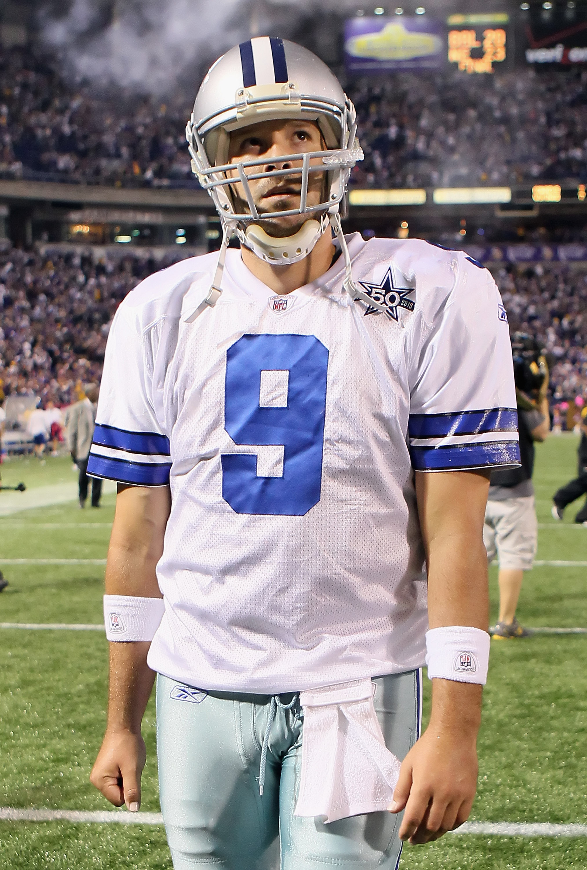 Dallas Cowboys quarterback Tony Romo (9) runs out of the pocket