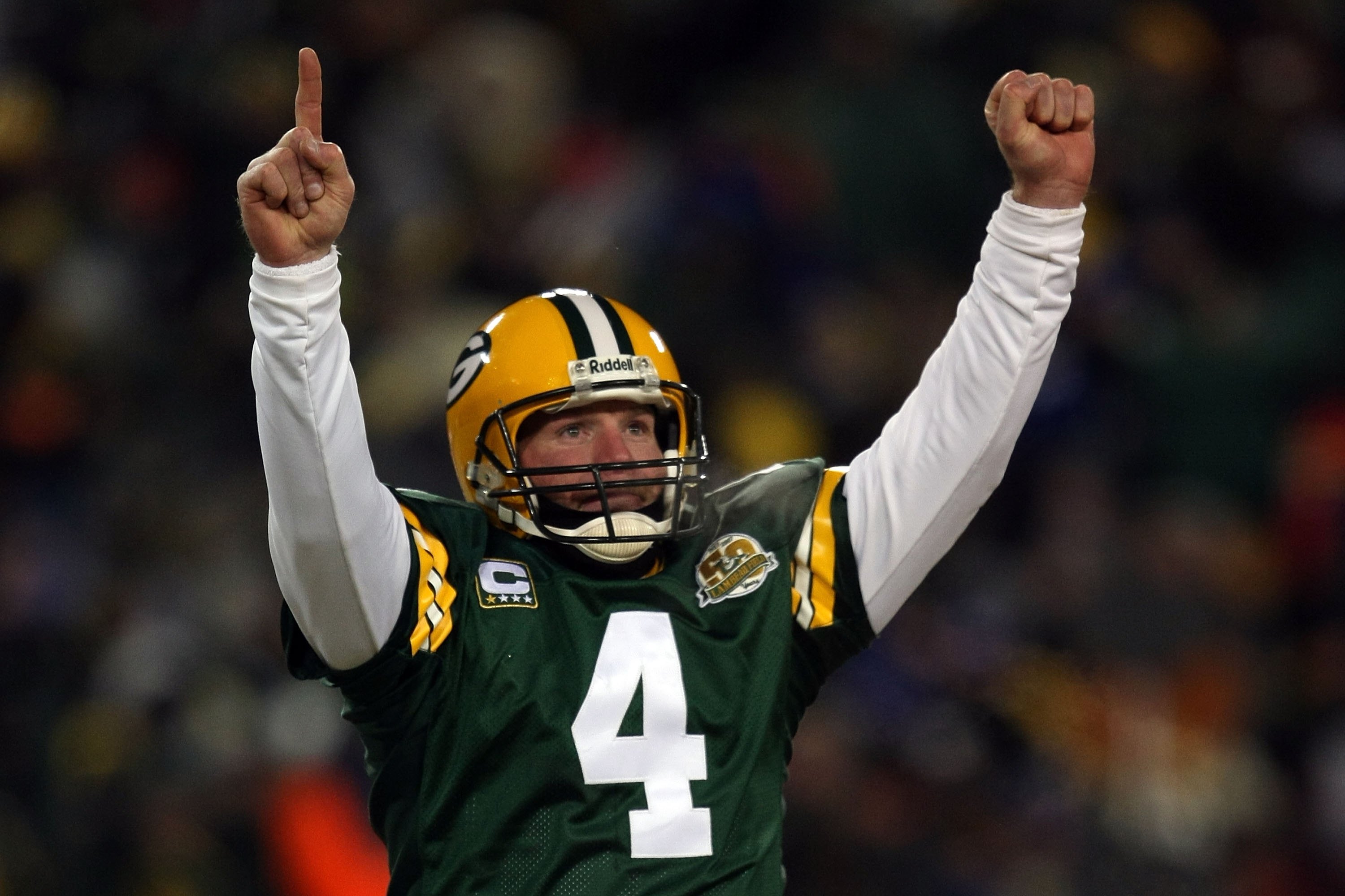 GREEN BAY, WI - JANUARY 20:  Quarterback Brett Favre #4 of the Green Bay Packers reacts after a Packers touchdown during the NFC championship game against the New York Giants on January 20, 2008 at Lambeau Field in Green Bay, Wisconsin. The Giants defeate