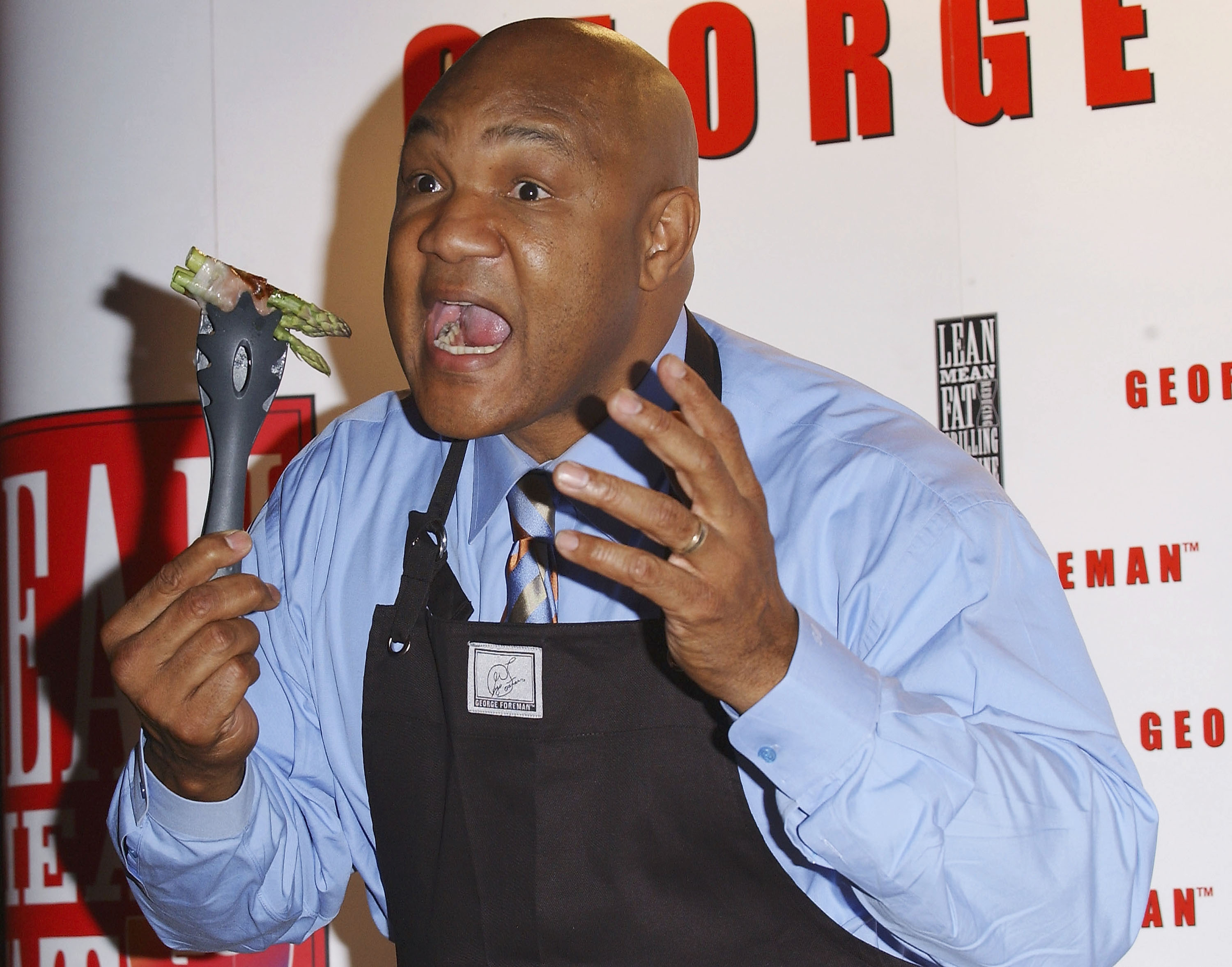 LONDON - DECEMBER 17:  Former World Heavyweight Champion George Foreman launches new additions to his Lean Mean range, at No 5, Cavendish Square on December 17, 2003 in London. New additions include the Lean Mean Toasting Machine and the Lean Mean Boiling