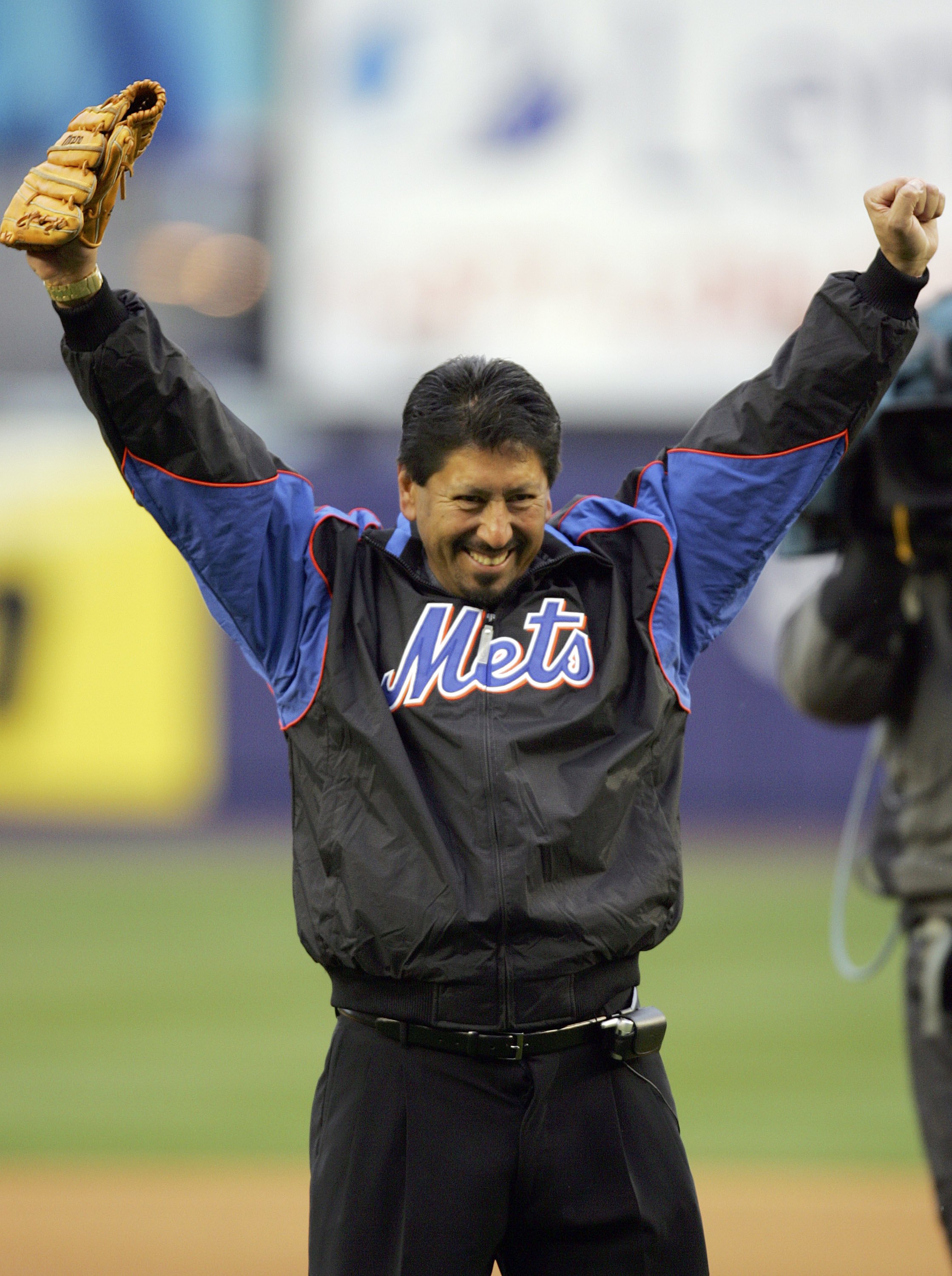 FLUSHING, NY - APRIL 3:  1986 Mets World Series Champion Jesse Orosco throws out the first pitch to his old teammate Gary Carter before the Washington Nationals play the New York Mets on Opening Day at Shea Stadium on April 3, 2006 in Flushing neighborhoo
