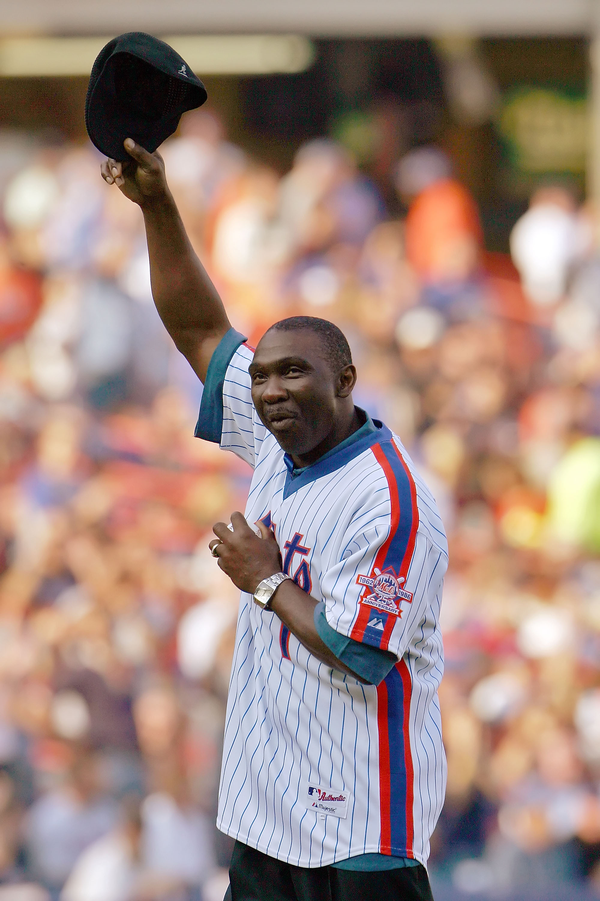 NEW YORK - OCTOBER 04:  Mookie Wilson formerly of the New York Mets waves to the fans before throwing out the first pitch for a game against the Los Angeles Dodgers in game one of the National League Division Series at Shea Stadium on October 4, 2006 in t