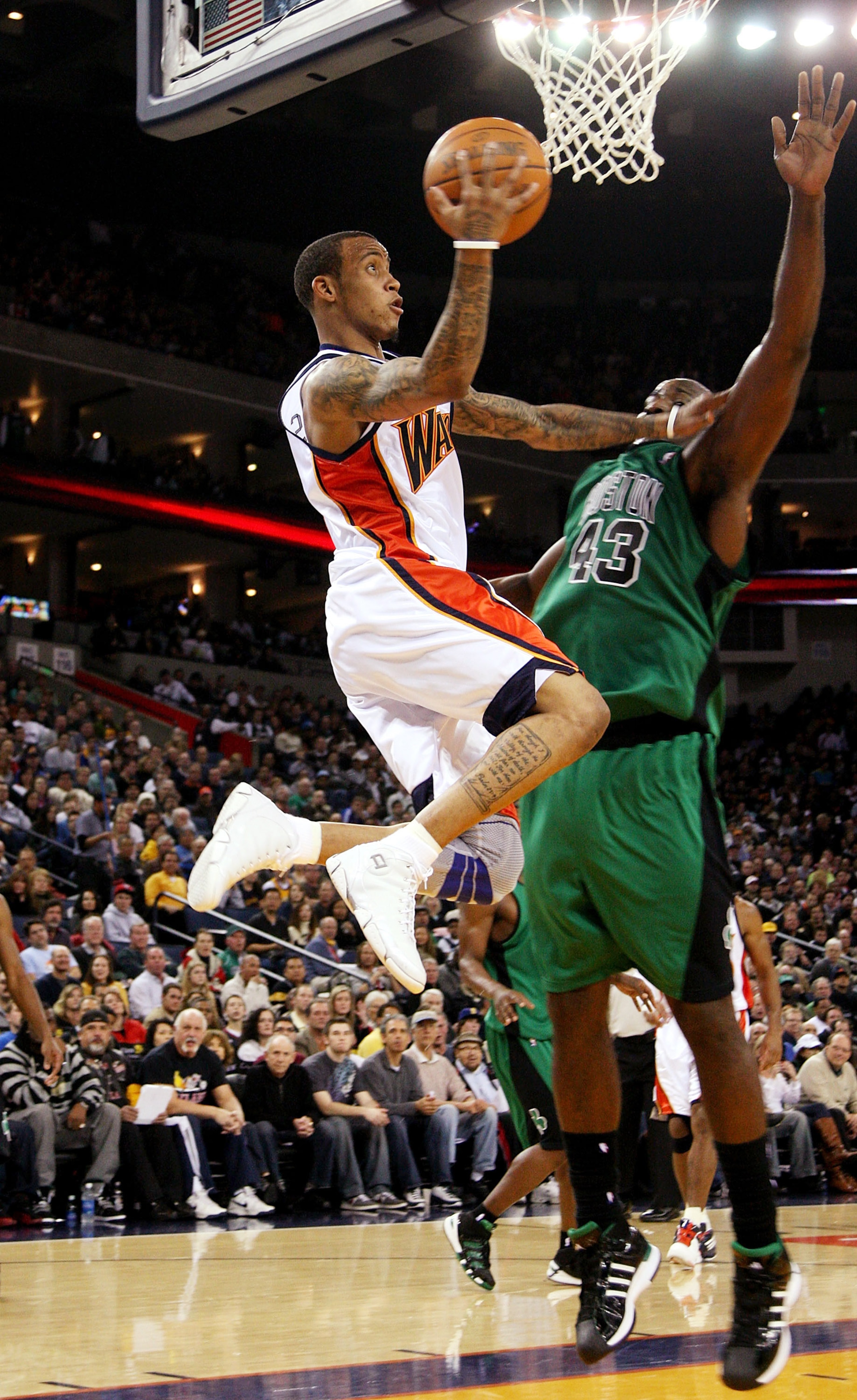 OAKLAND, CA - DECEMBER 28: Monta Ellis #8 of the Golden State Warriors shoots over Kendrick Perkins #43 of the Boston Celtics during an NBA game at Oracle Arena on December 28, 2009 in Oakland, California. NOTE TO USER: User expressly acknowledges and agr