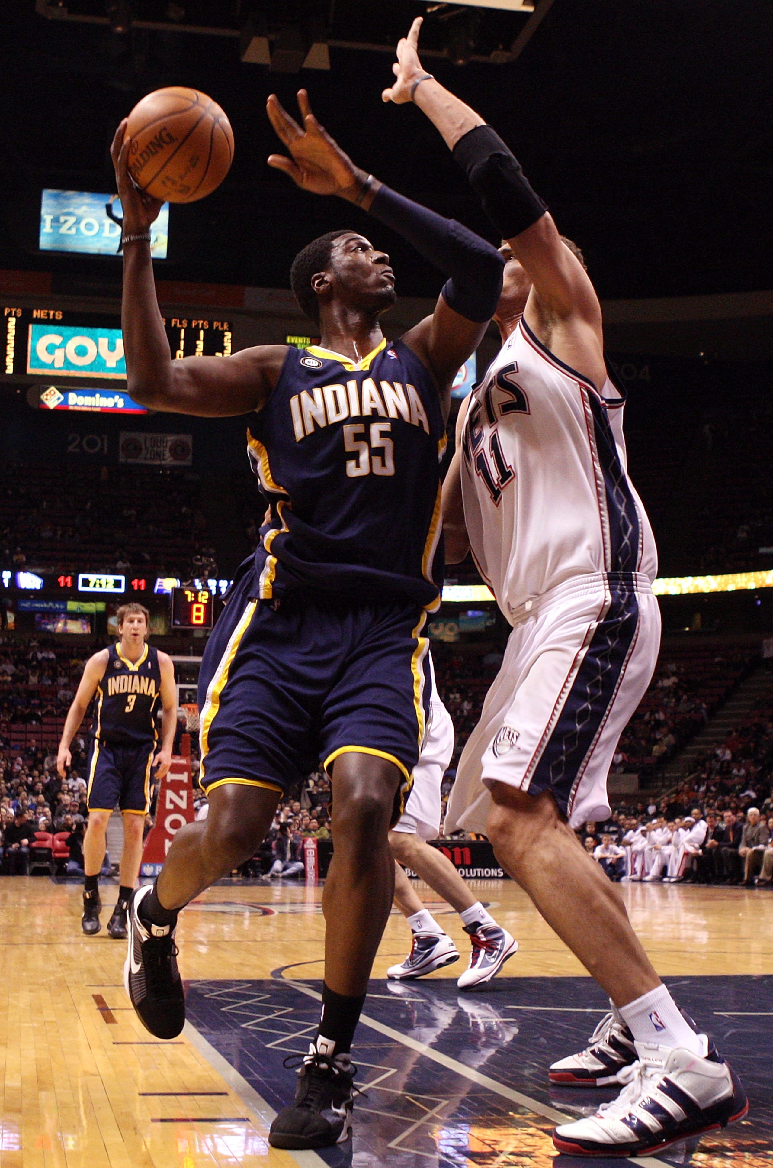EAST RUTHERFORD, NJ - JANUARY 15:  Roy Hibbert #55 of the Indiana Pacers shoots against Brook Lopez #11 of the New Jersey Nets at the Izod Center on January 15, 2010 in East Rutherford, New Jersey. NOTE TO USER: User expressly acknowledges and agrees that