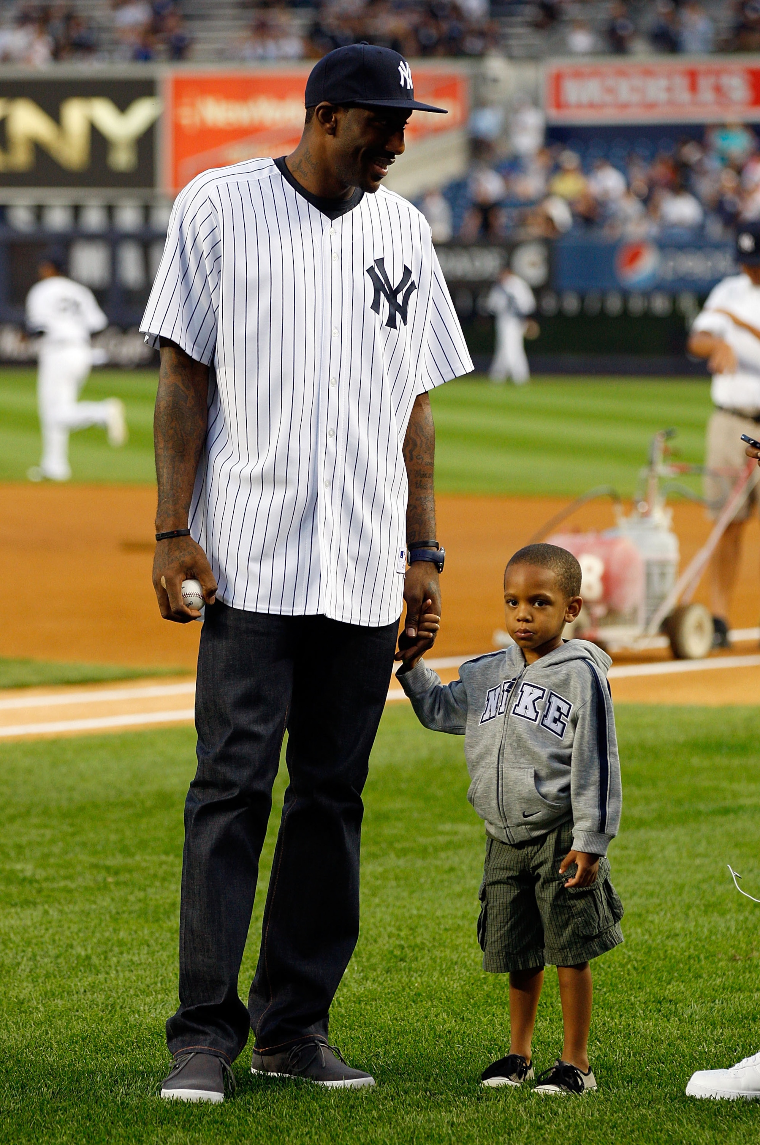 NEW YORK - SEPTEMBER 23:  Amar'e Stoudemire of the New York Knicks and his son Amar'e Jr. look on prior to the game between the New York Yankees and the Tampa Bay Rays on September 23, 2010 at Yankee Stadium in the Bronx borough of New York City.  (Photo