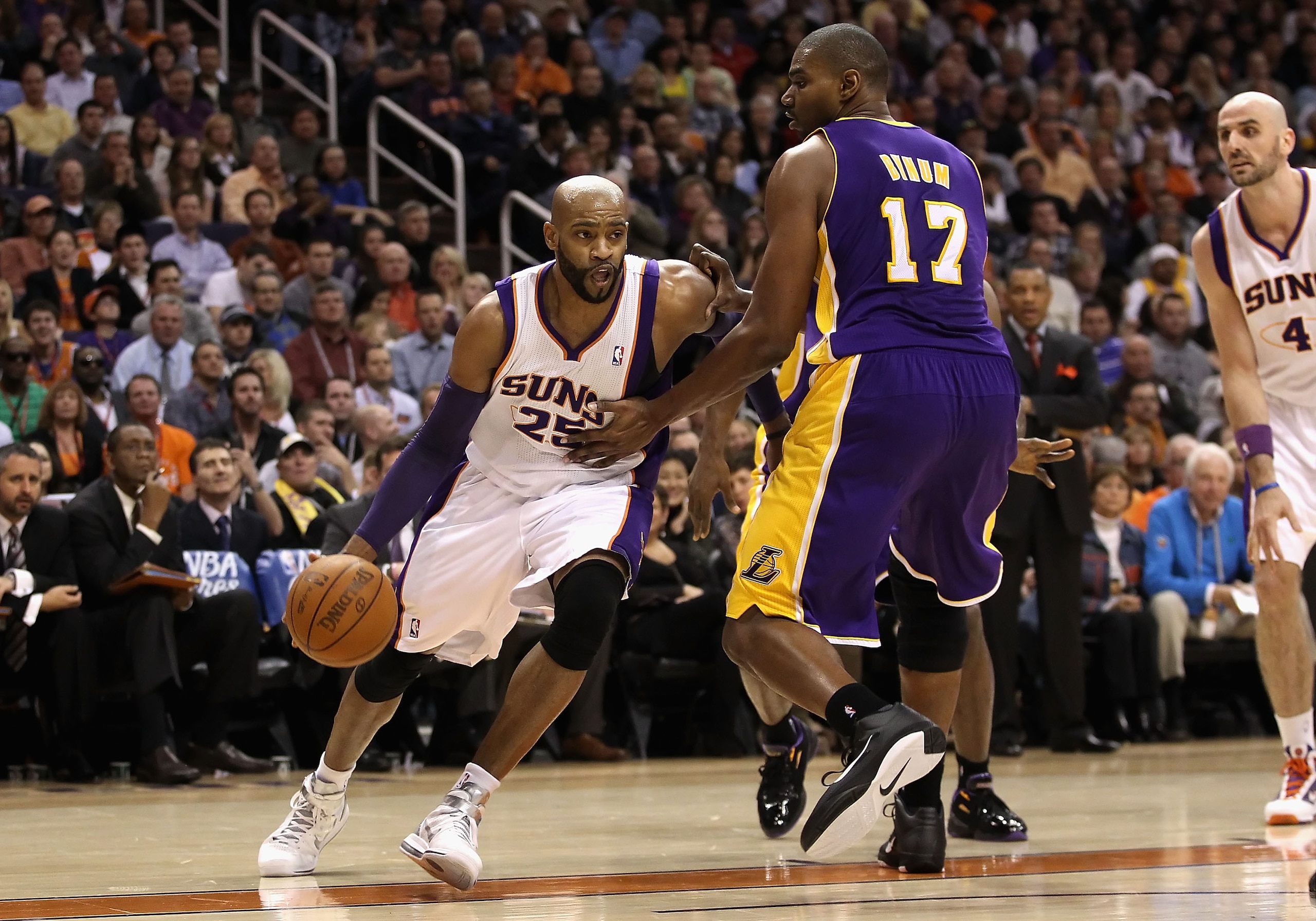 PHOENIX, AZ - JANUARY 05:   Vince Carter #25 of the Phoenix Suns drives the ball against the Los Angeles Lakers during the NBA game at US Airways Center on January 5, 2011 in Phoenix, Arizona. The Lakers defeated the Suns 99-95.  NOTE TO USER: User expres