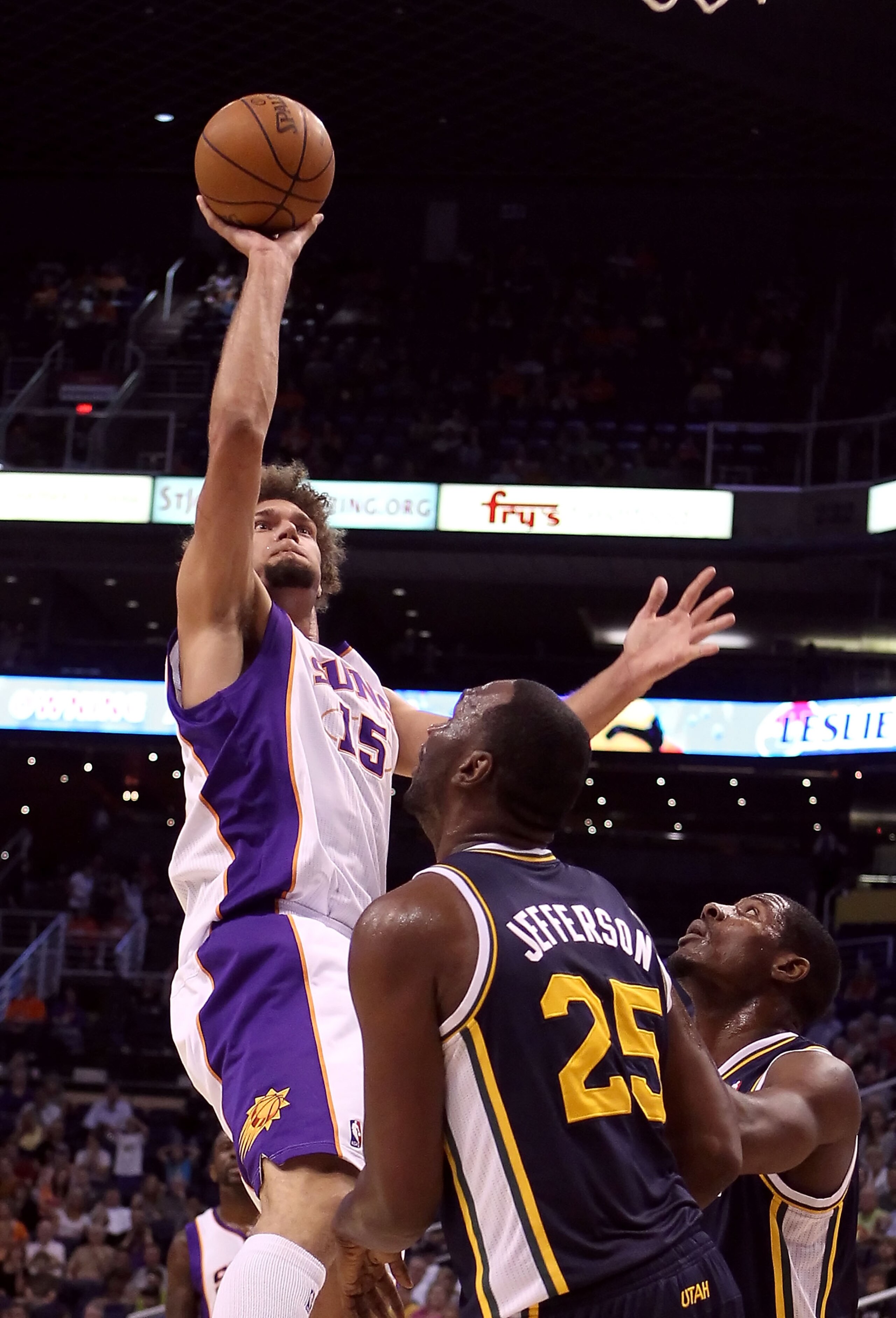 PHOENIX - OCTOBER 12:  Robin Lopez #15 of the Phoenix Suns puts up a shot during the preseason NBA game against the Utah Jazz at US Airways Center on October 12, 2010 in Phoenix, Arizona. NOTE TO USER: User expressly acknowledges and agrees that, by downl