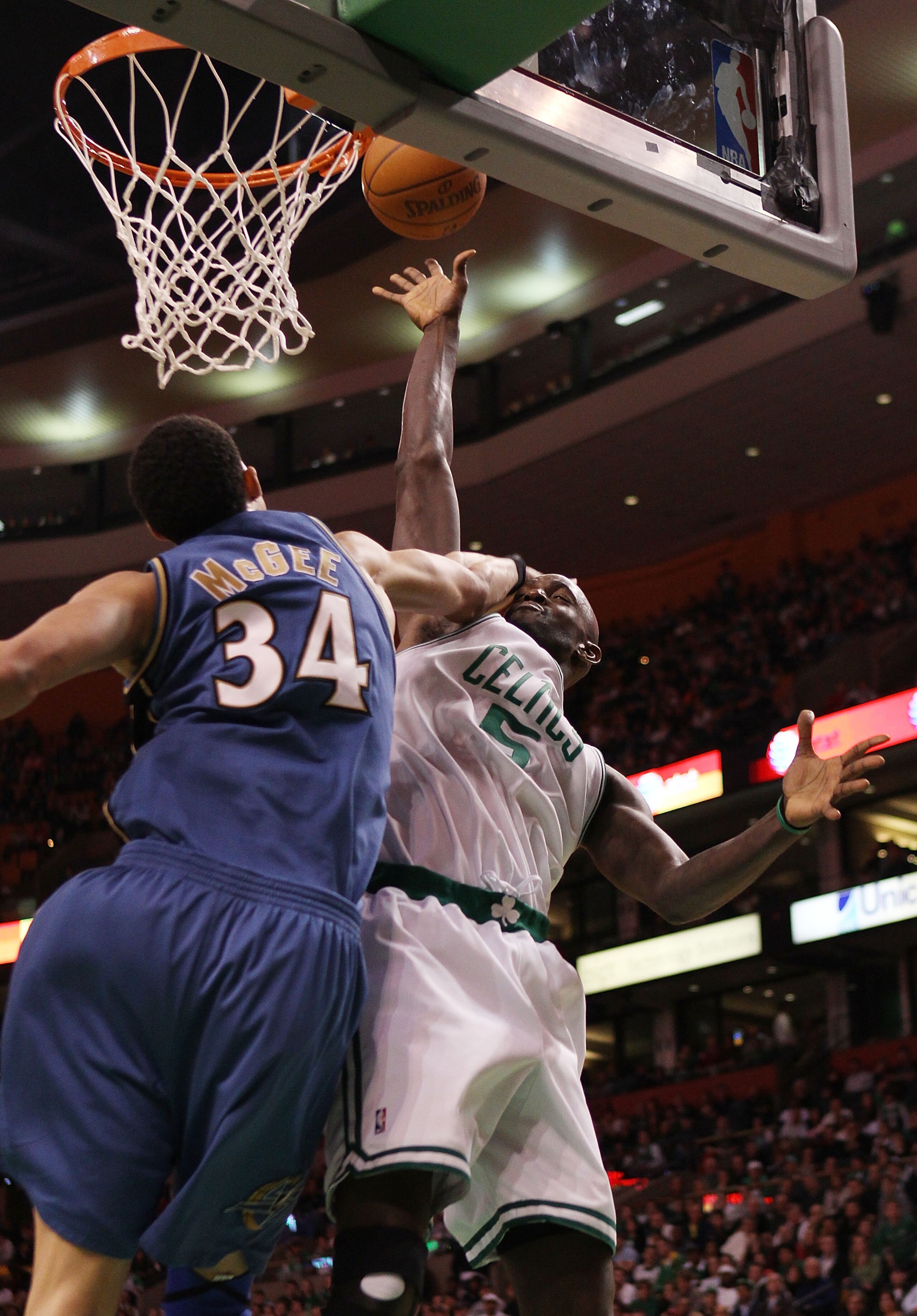 BOSTON - MARCH 07:  Kevin Garnett #5 of the Boston Celtics is fouled by JaVale McGee #34 of the Washington Wizards on March 7, 2010 at the TD Garden in Boston, Massachusetts. The Celtics defeated the Wizards 86-83. NOTE TO USER: User expressly acknowledge