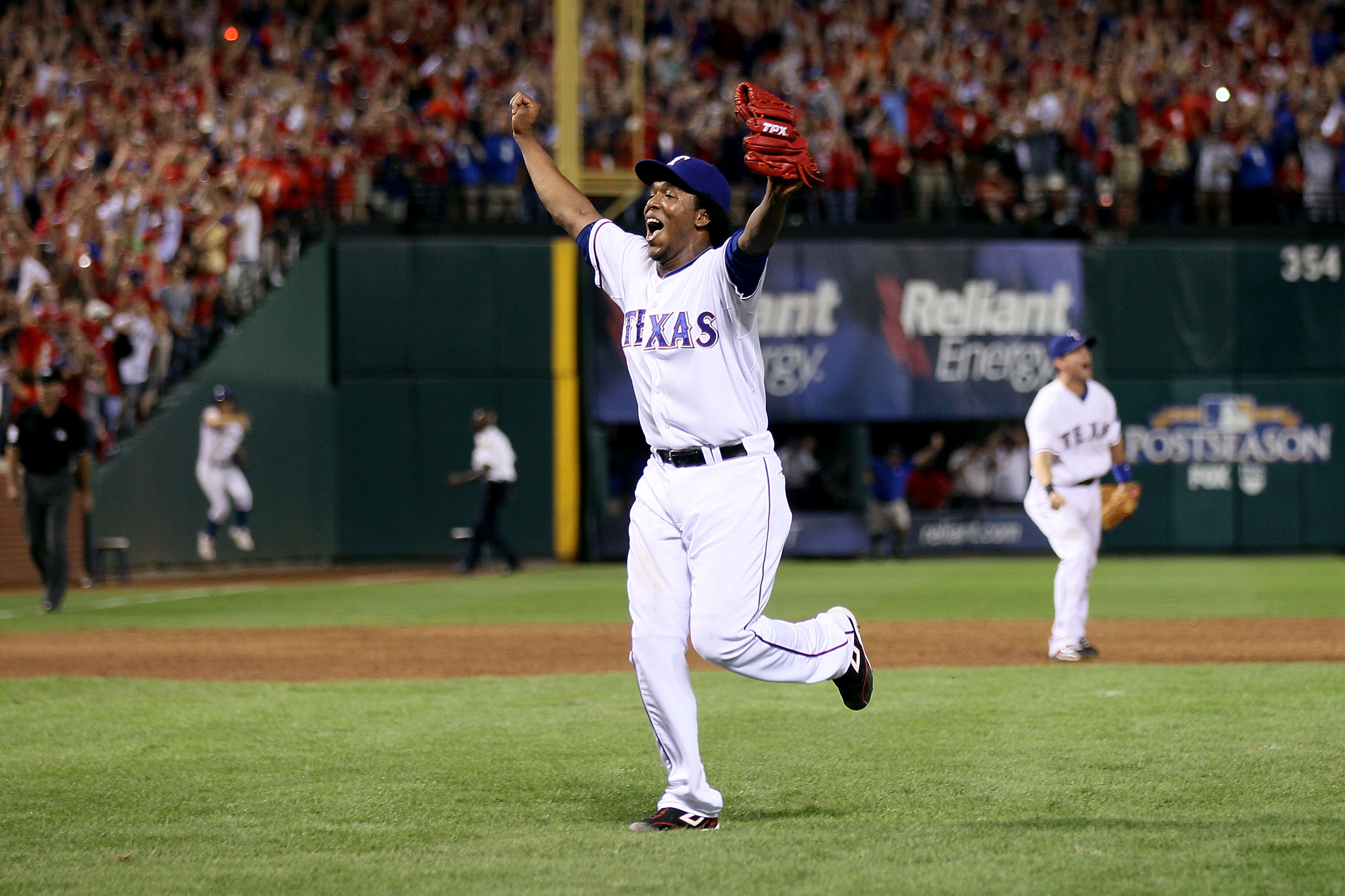 ARLINGTON, TX - OCTOBER 22:  Neftali Feliz #30 of the Texas Rangers celebrates after defeating the New York Yankees  6-1 in Game Six of the ALCS during the 2010 MLB Playoffs at Rangers Ballpark in Arlington on October 22, 2010 in Arlington, Texas.  (Photo