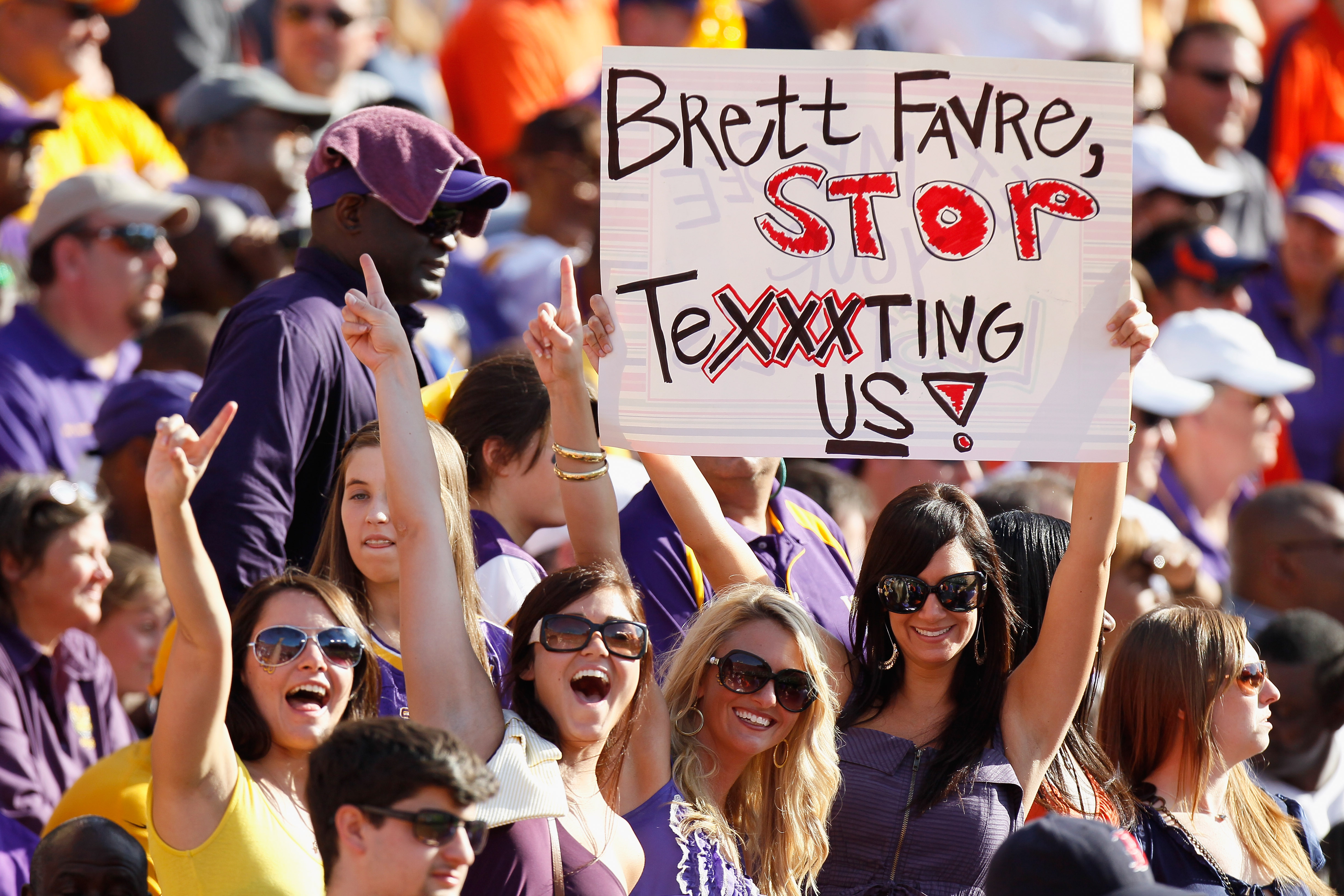 Minnesota Vikings fans hold up a sign wishing quarterback Brent