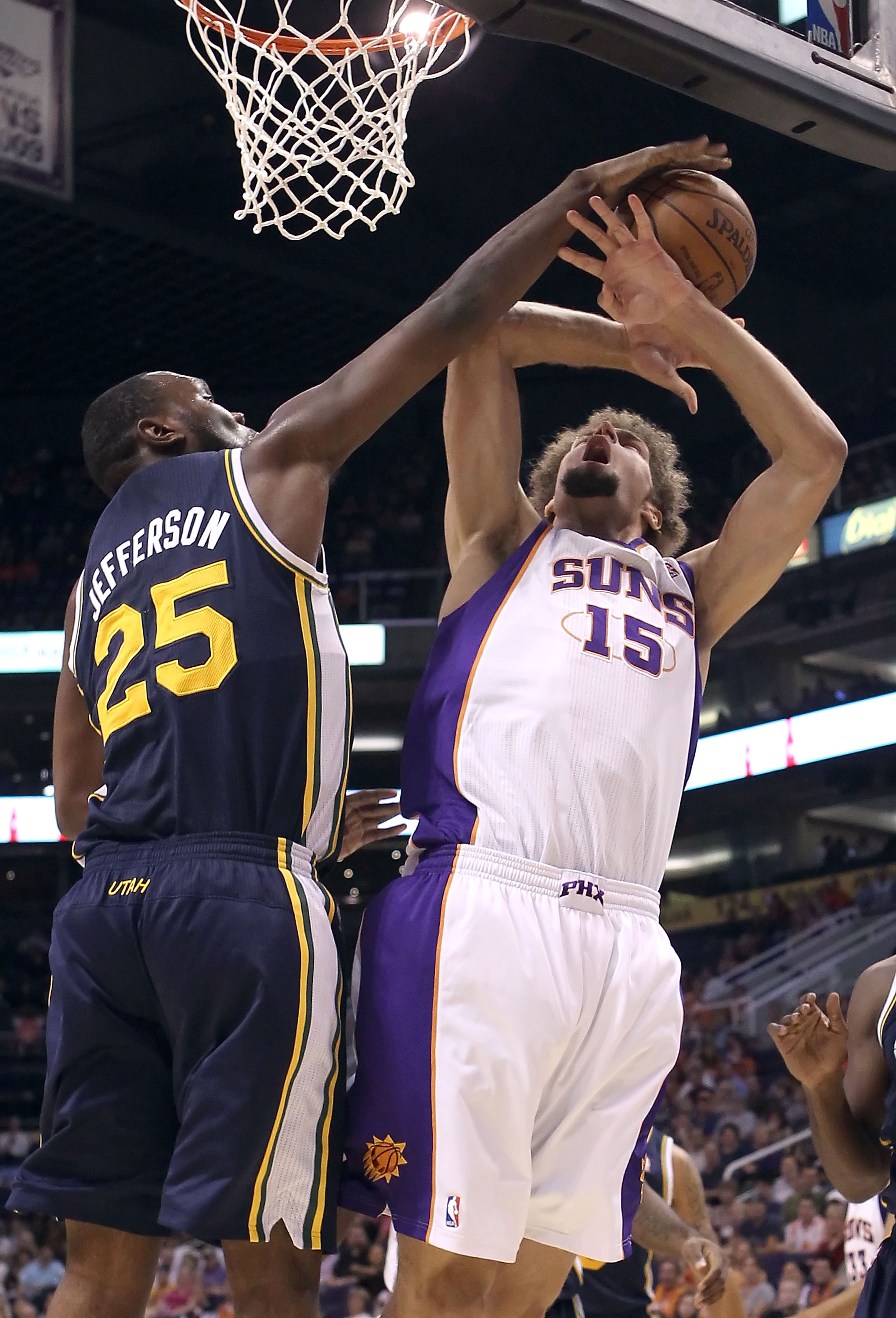 PHOENIX - OCTOBER 12:  Al Jefferson #25 of the Utah Jazz blocks a shot from Robin Lopez #15 of the Phoenix Suns during the preseason NBA game at US Airways Center on October 12, 2010 in Phoenix, Arizona. NOTE TO USER: User expressly acknowledges and agree