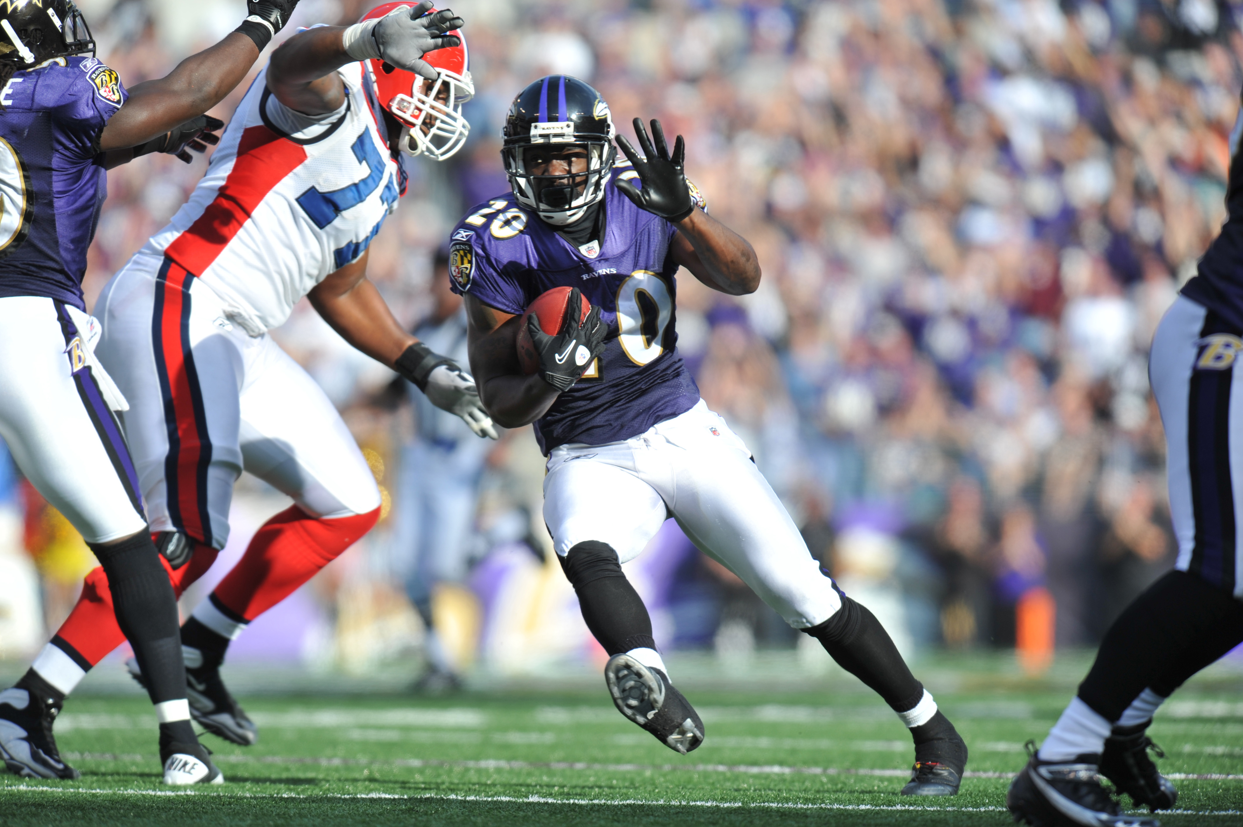 The Buffalo Bills' Roscoe Parrish (11) holds onto the ball as he is hit by  the Baltimore Ravens' Ed Reed (20) in the second half of their game on  Sunday, December 31