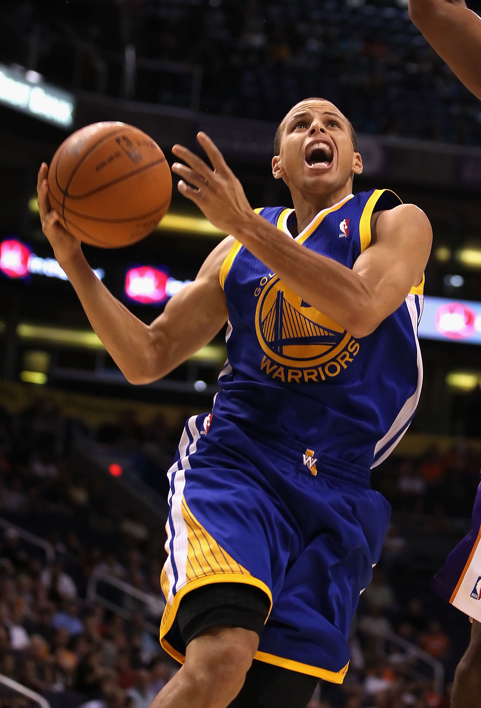 PHOENIX - OCTOBER 19:  Stephen Curry #30 of the Golden State Warriors drives to the basket during the preseason NBA game against the Phoenix Suns at US Airways Center on October 19, 2010 in Phoenix, Arizona. NOTE TO USER: User expressly acknowledges and a