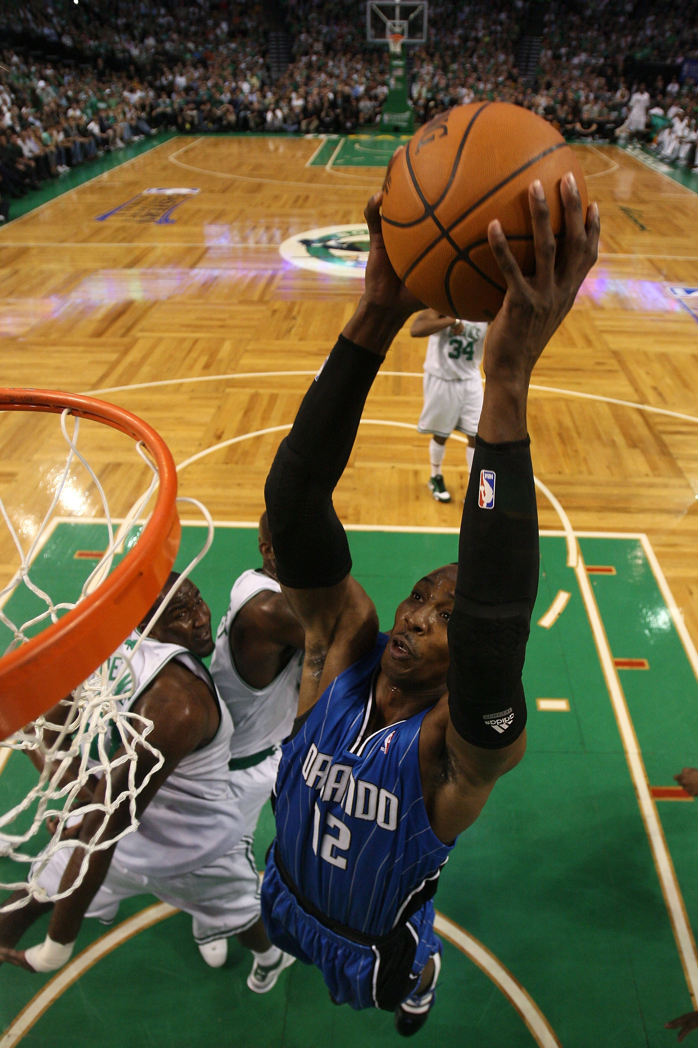 BOSTON - MAY 28:  Dwight Howard #12 of the Orlando Magic dunks against the Boston Celtics in Game Six of the Eastern Conference Finals during the 2010 NBA Playoffs at TD Garden on May 28, 2010 in Boston, Massachusetts.  NOTE TO USER: User expressly acknow
