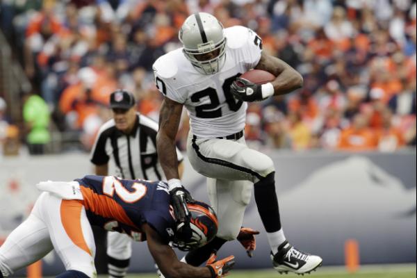 Oakland, California, USA. 6th Dec, 2012. Oakland Raiders running back  Darren McFadden (20) celebrates touchdown in black hole on Thursday at O.co  Coliseum in Oakland, CA. The Broncos defeated the Raiders 26-13.