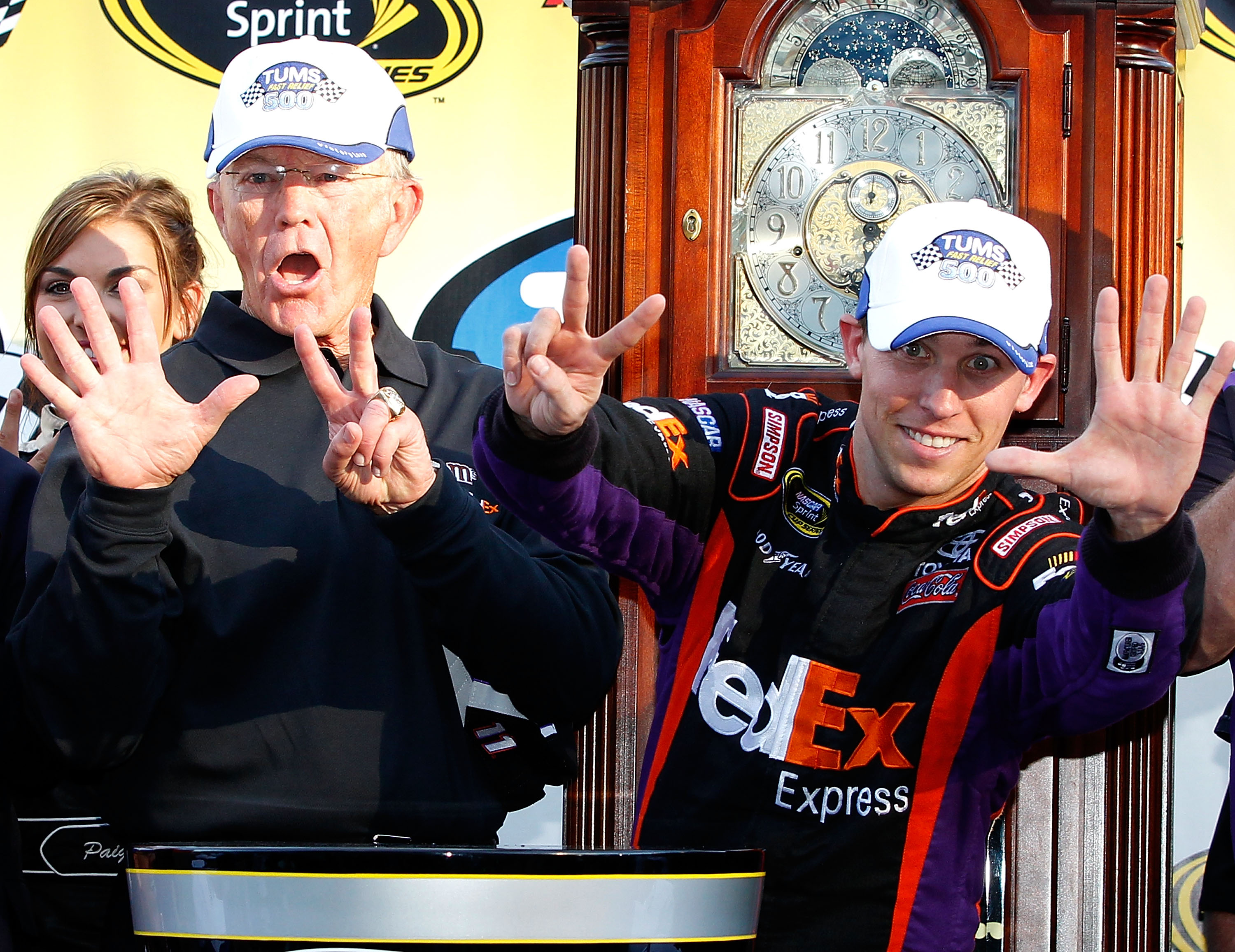 MARTINSVILLE, VA - OCTOBER 24: Denny Hamlin (R), driver of the #11 FedEx Express Toyota, celebrates with car owner Joe Gibbs (L), in victory lane after winning the NASCAR Sprint Cup Series TUMS Fast Relief 500 at Martinsville Speedway on October 24, 2010 