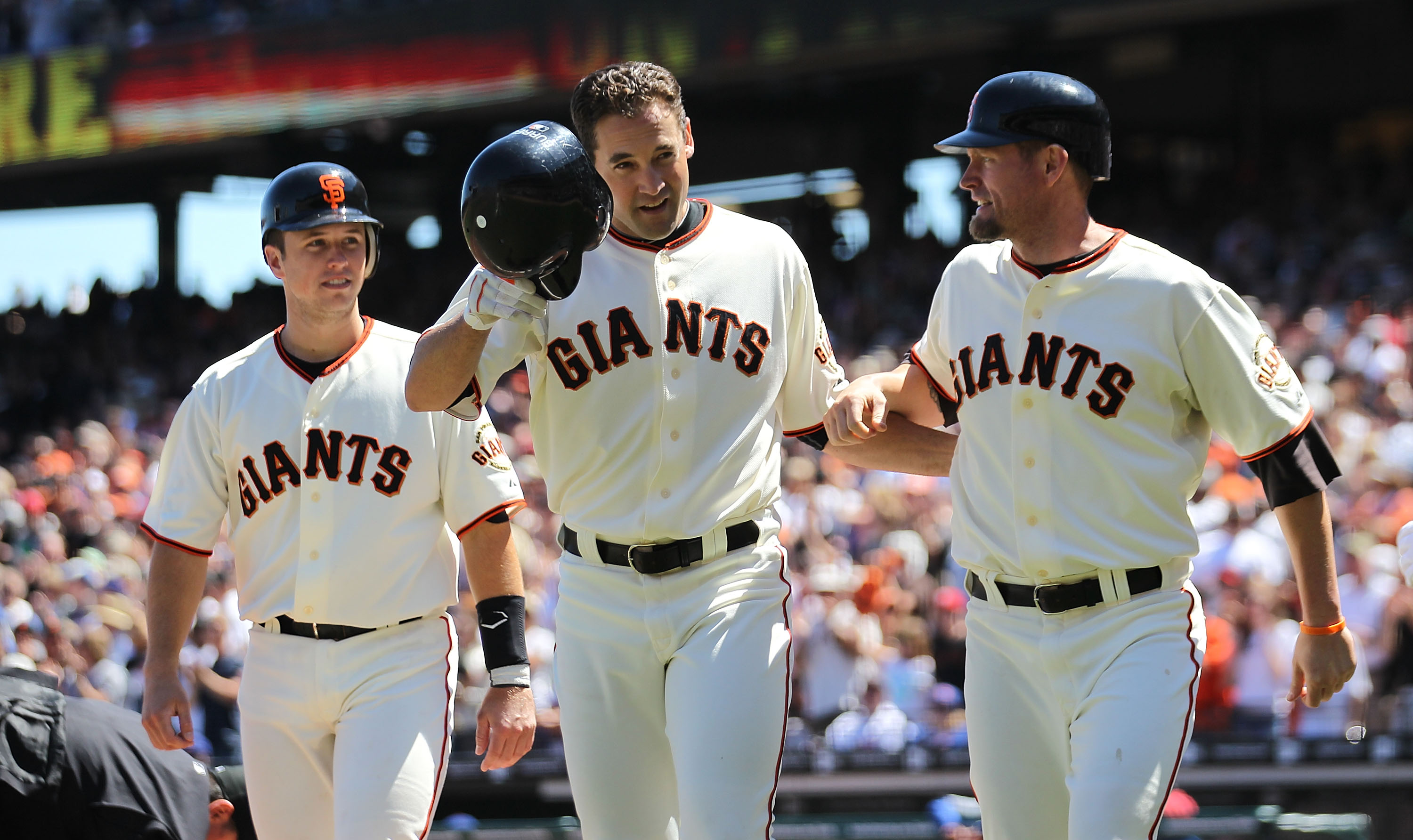 Pat Burrell, Brian Wilson and Aubrey Huff begin the celebration as