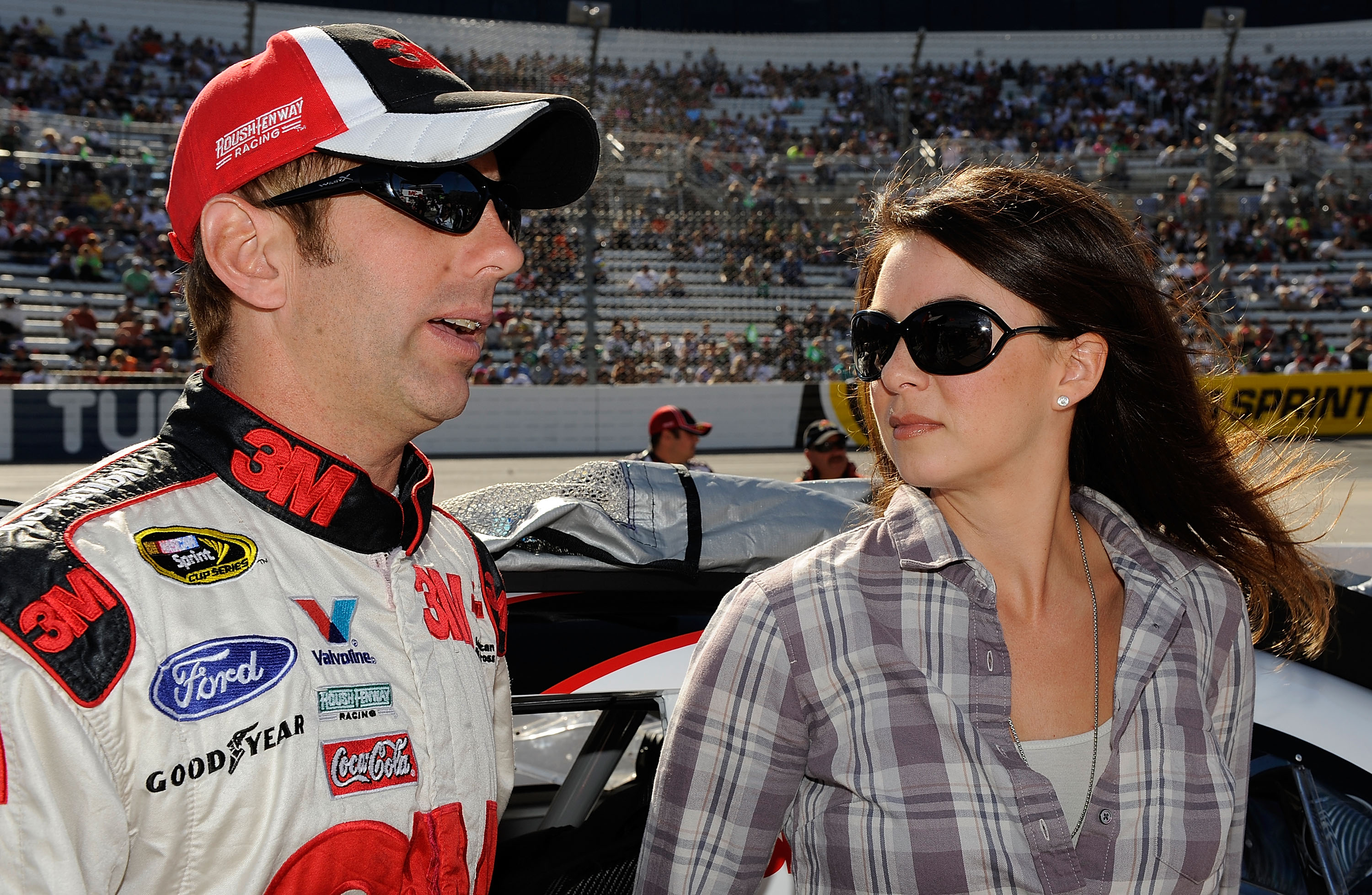 MARTINSVILLE, VA - OCTOBER 24:  Greg Biffle (L), driver of the #16 3M Ford, stands on the grid with his wife Nicole prior to the during the NASCAR Sprint Cup Series TUMS Fast Relief 500 at Martinsville Speedway on October 24, 2010 in Martinsville, Virgini