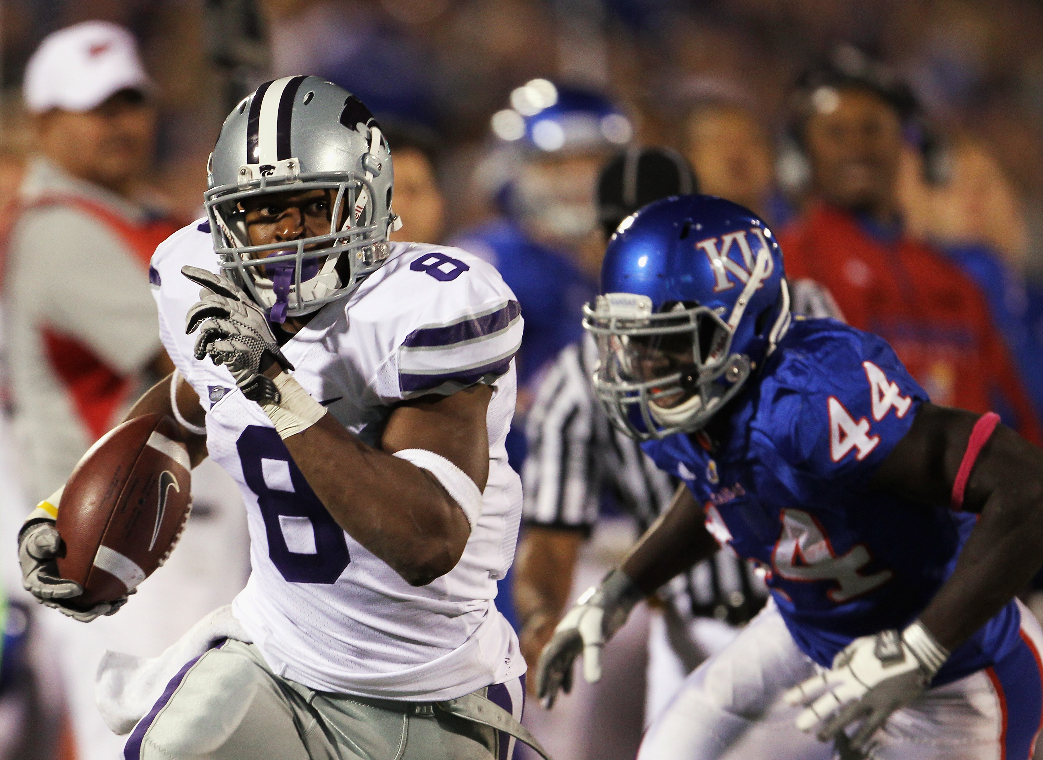 LAWRENCE, KS - OCTOBER 14: Daniel Thomas #8 of the Kansas State Wildcats carries the ball as Olaitan Oguntodu #44 of the Kansas Jayhawks defends during the game on October 14, 2010 at Memorial Stadium in Lawrence, Kansas. (Photo by Jamie Squire/Getty Im
