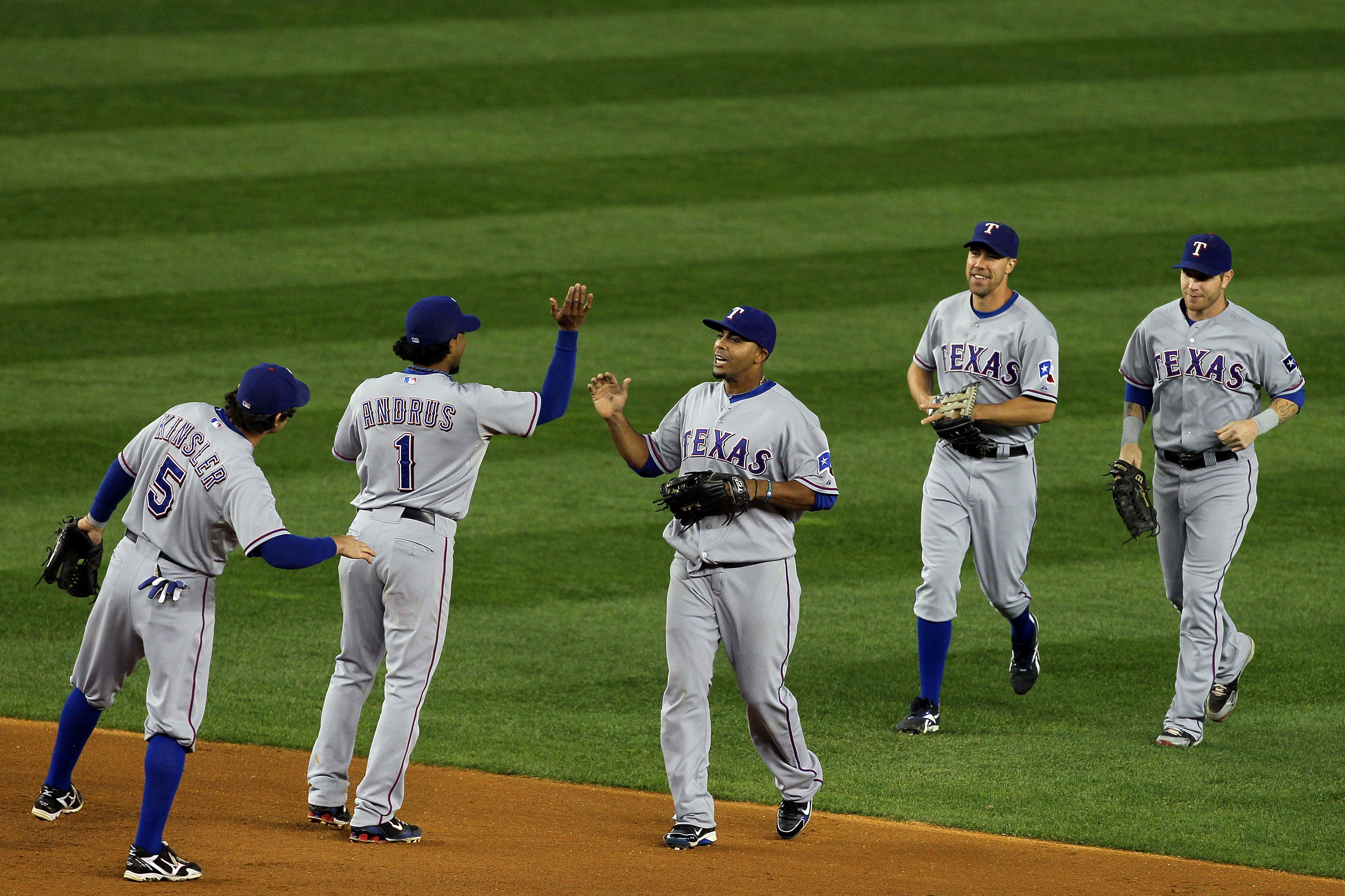 NEW YORK - OCTOBER 18:  (L-R) Ian Kinsler #5, Elvis Andrus #1, Nelson Cruz #17, David Murphy #7 and Josh Hamilton #32 of the Texas Rangers celebrate after the Rangers won 8-0 against the New York Yankees in Game Three of the ALCS during the 2010 MLB Playo