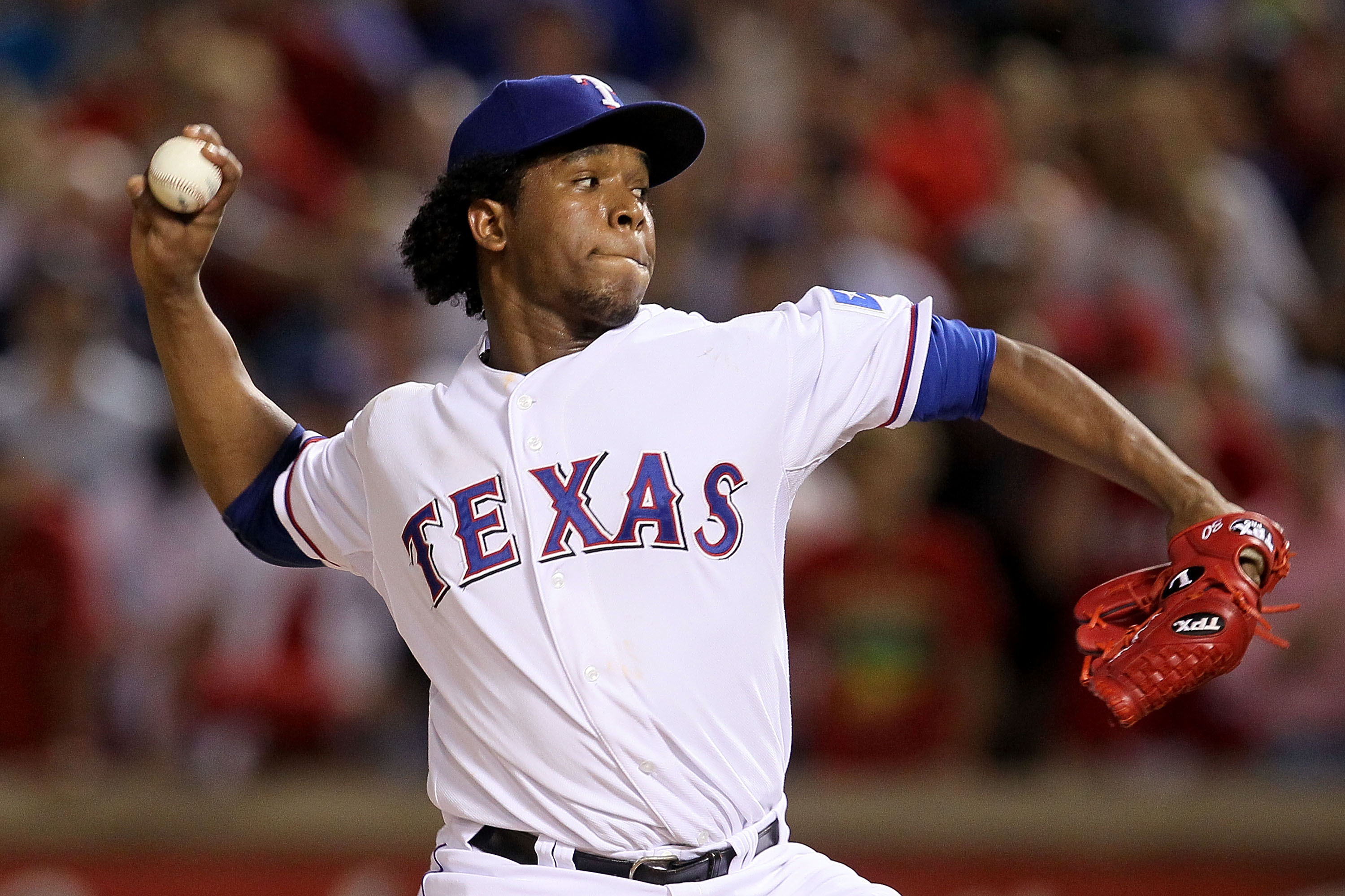 ARLINGTON, TX - OCTOBER 22:  Neftali Feliz #30 of the Texas Rangers throws a pitch against the New York Yankees in the ninth inning of Game Six of the ALCS during the 2010 MLB Playoffs at Rangers Ballpark in Arlington on October 22, 2010 in Arlington, Tex