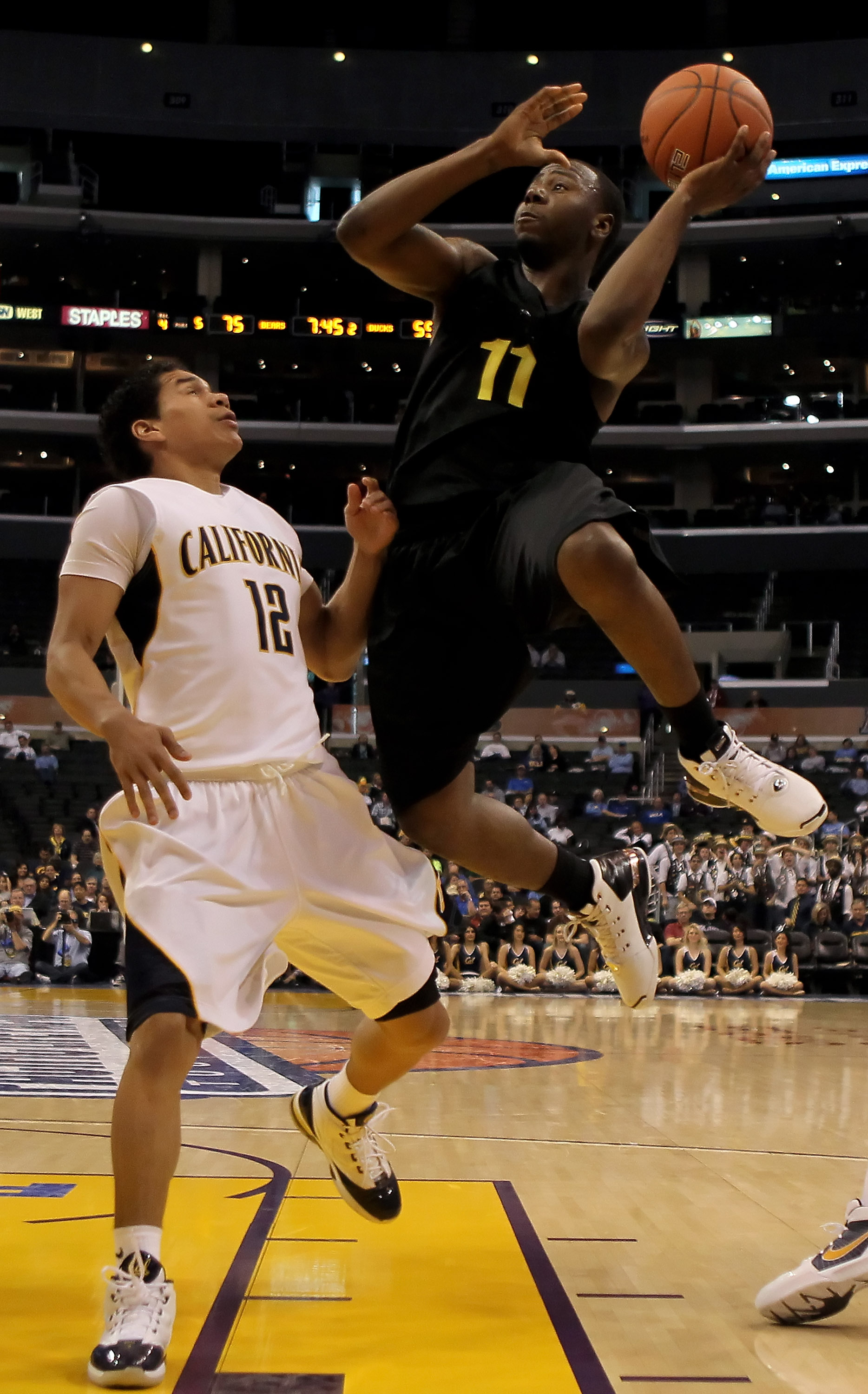 LOS ANGELES, CA - MARCH 11: Malcolm Armstead #11 of the Oregon ducks shoots over Brandon Smith #12 of the Cal Golden Bears in the second half during the Quarterfinals of the Pac-10 Basketball Tournament at Staples Center on March 11, 2010 in Los Angeles,