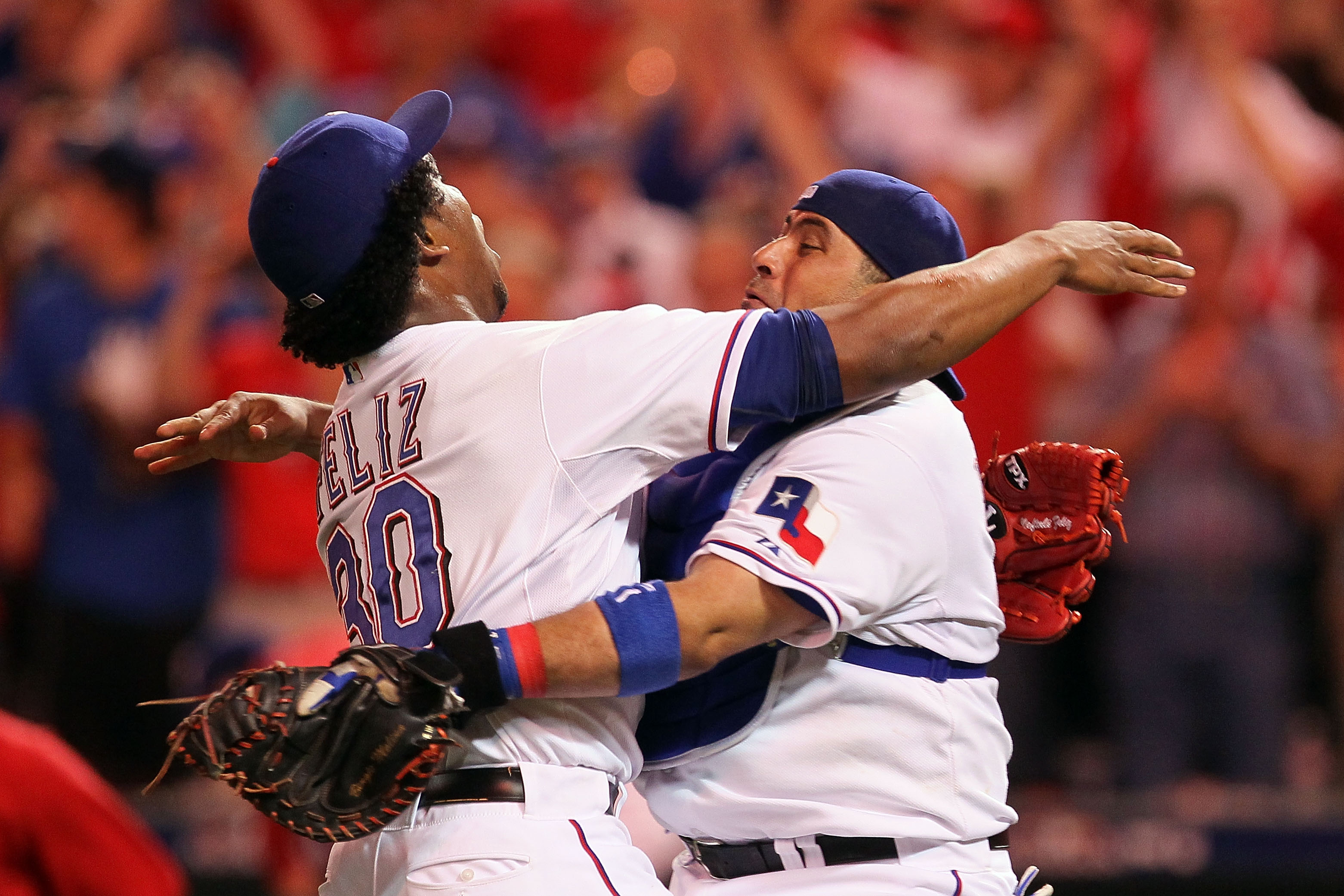 ARLINGTON, TX - OCTOBER 22:  Bengie Molina #11 and Neftali Feliz #30 of the Texas Rangers celebrate after defeating the New York Yankees 6-1 in Game Six of the ALCS to advance to the World Series during the 2010 MLB Playoffs at Rangers Ballpark in Arlingt