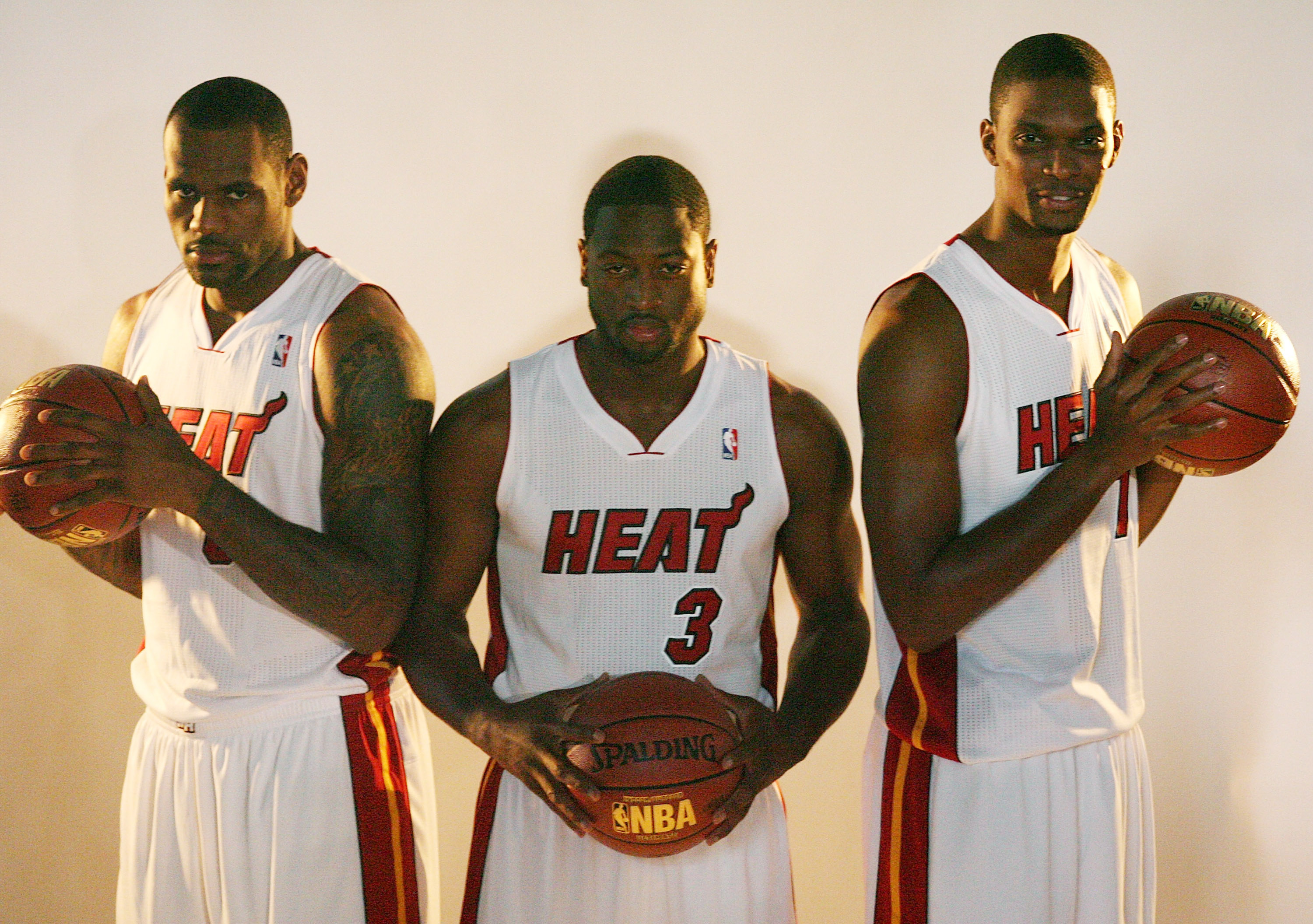 MIAMI - SEPTEMBER 27:  (L-R) LeBron James, Dwyane Wade and Chris Bosh of the Miami Heat pose for photos during media day at the Bank United Center on September 27, 2010 in Miami, Florida.  (Photo by Marc Serota/Getty Images)