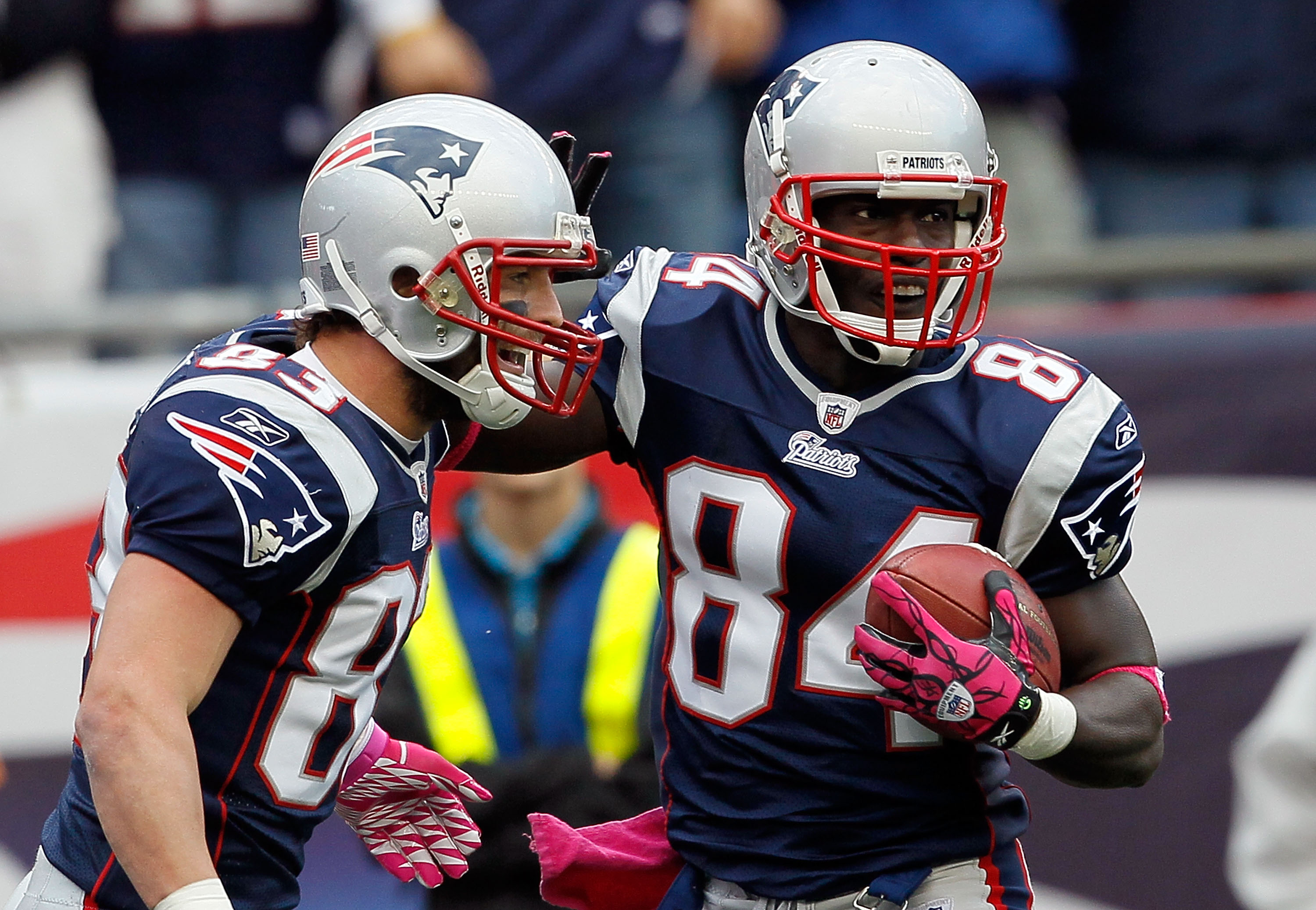 FOXBORO, MA - OCTOBER 17:  Wes Welker #83 celebrate with teammate Deion Branch #84, both of the New England Patriots, after Branch caught a touchdown pass in the second half against the Baltimore Ravens at Gillette Stadium on October 17, 2010 in Foxboro,