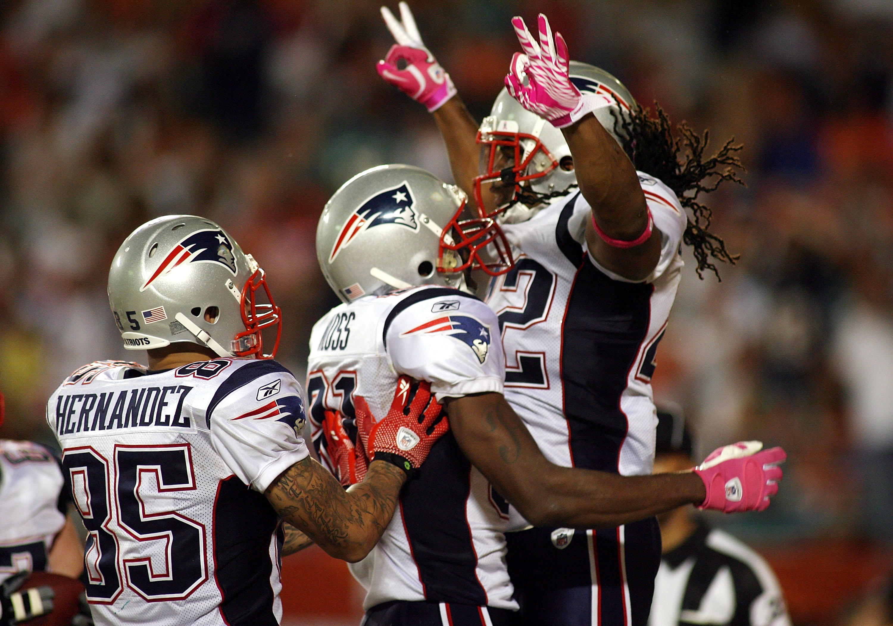 MIAMI - OCTOBER 04:  Running backBenjarvus Green-Ellis #42 of the New England Patriots celebrates a touchdown with teammate Randy Moss #81 against the Miami Dolphins at Sun Life Stadium on October 4, 2010 in Miami, Florida.  (Photo by Marc Serota/Getty Im