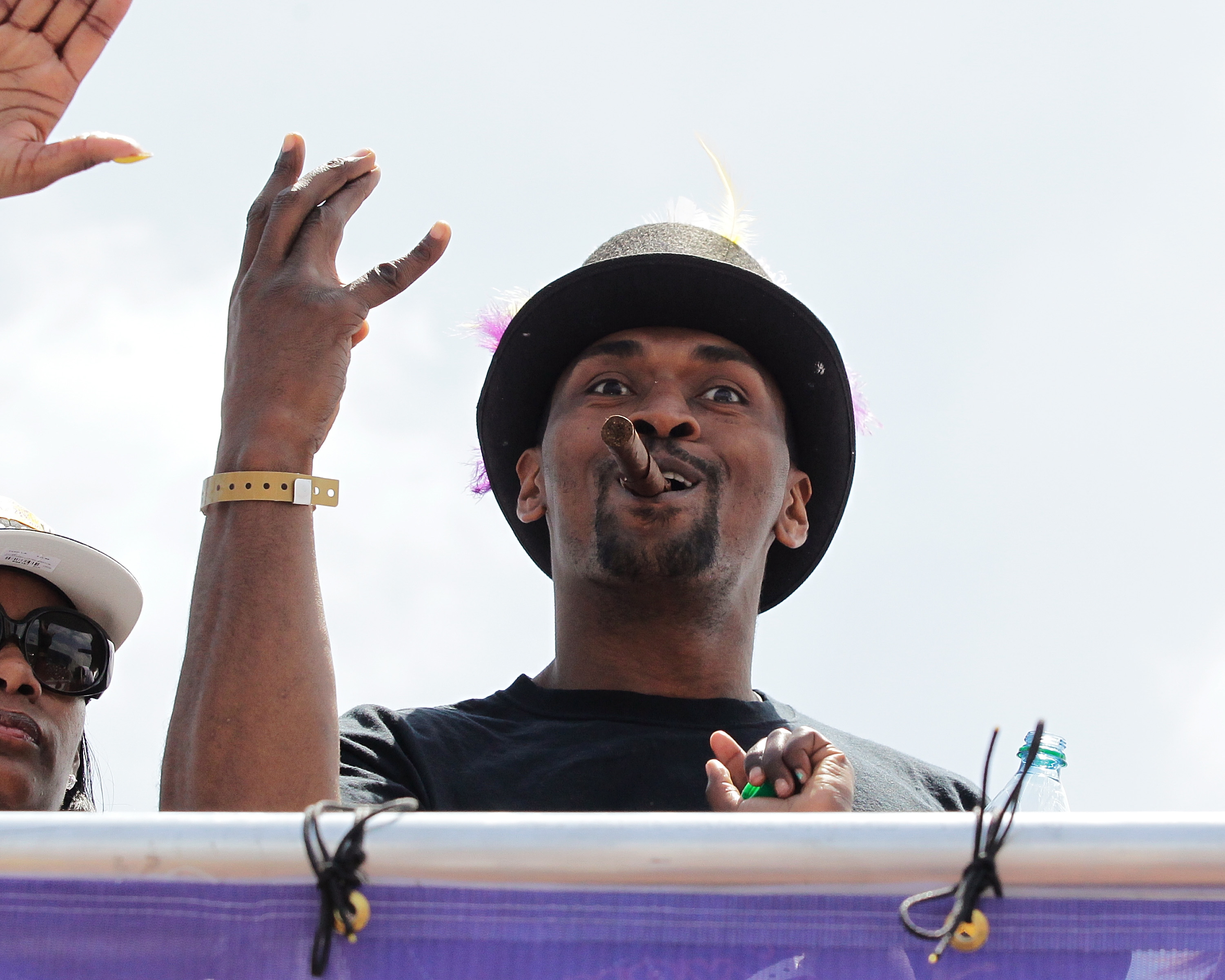 LOS ANGELES, CA - JUNE 21:  Los Angeles Lakers small forward Ron Artest waves to the fans while riding in the victory parade for the the NBA basketball champion team on June 21, 2010 in Los Angeles, California. The Lakers beat the Boston Celtics 87-79 in