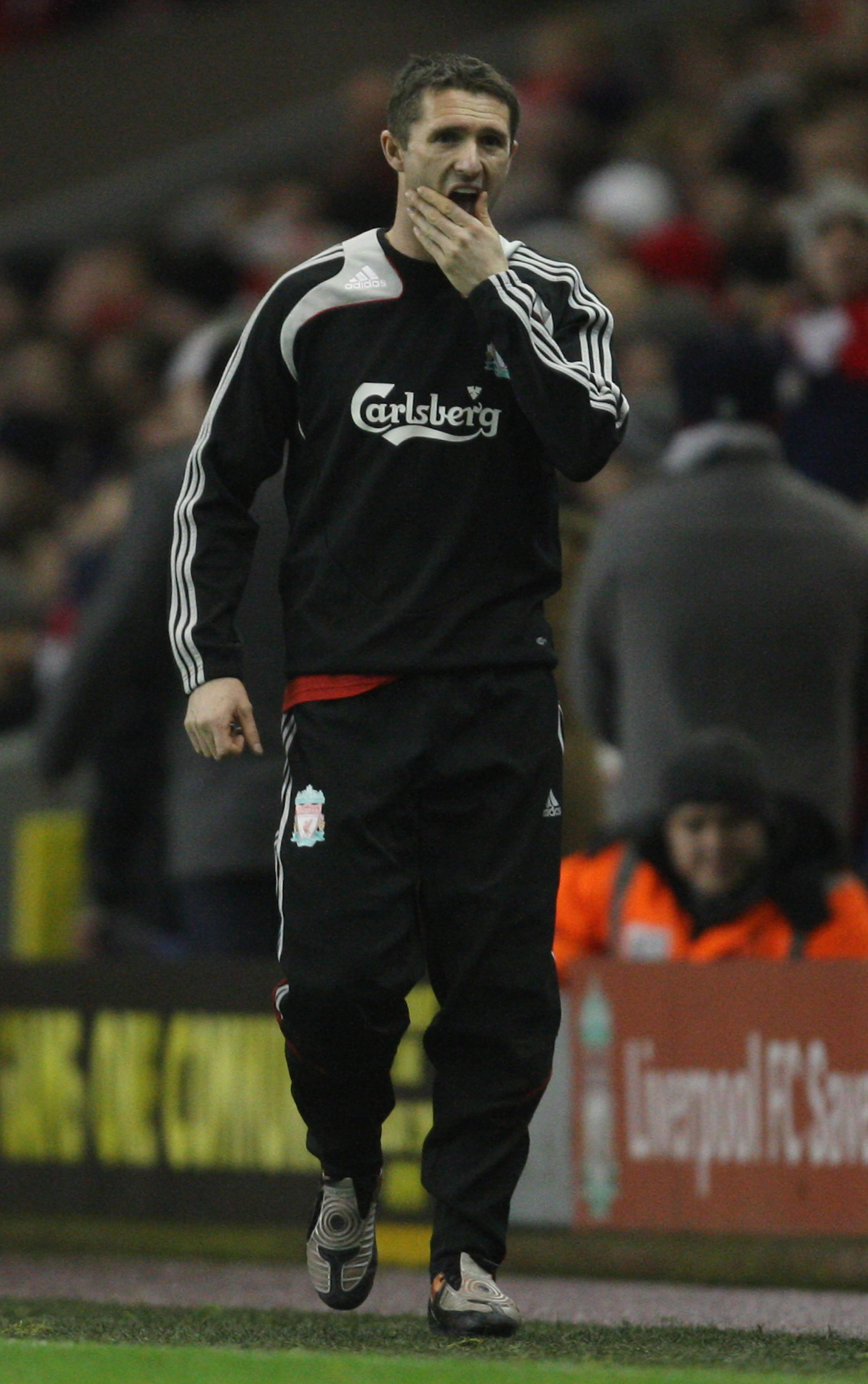 LIVERPOOL, UNITED KINGDOM - DECEMBER 13:  Robbie Keane of Liverpool warms up on the touchline during the Barclays Premier League match between Liverpool and Hull City at Anfield on December 13, 2008 in Liverpool, England.  (Photo by Hamish Blair/Getty Ima